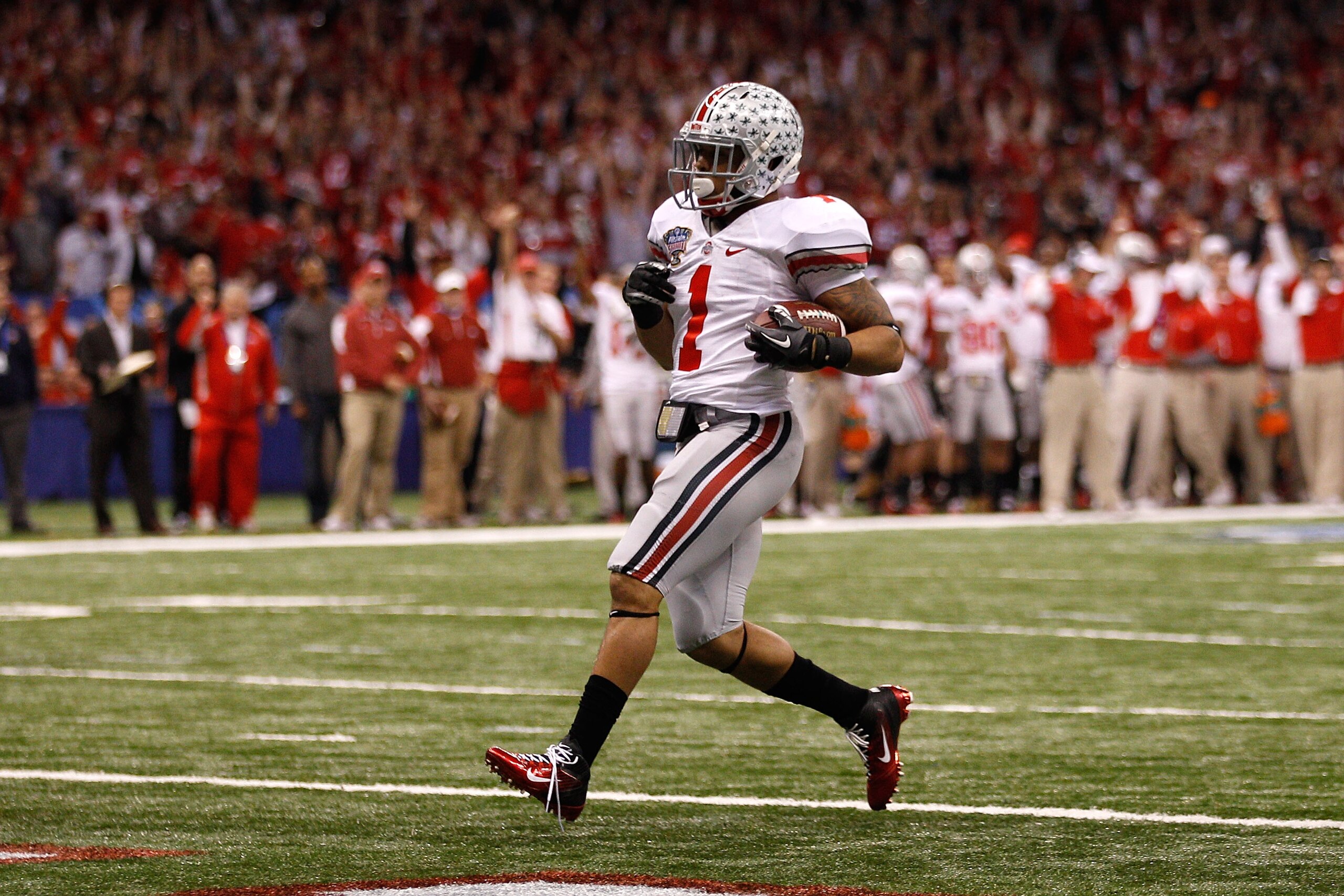 NEW ORLEANS, LA - JANUARY 04:  Dan Herron #1 of the Ohio State Buckeyes scores on a nine-yard touchdown run in the first half against the Arkansas Razorbacks during the Allstate Sugar Bowl at the Louisiana Superdome on January 4, 2011 in New Orleans, Loui