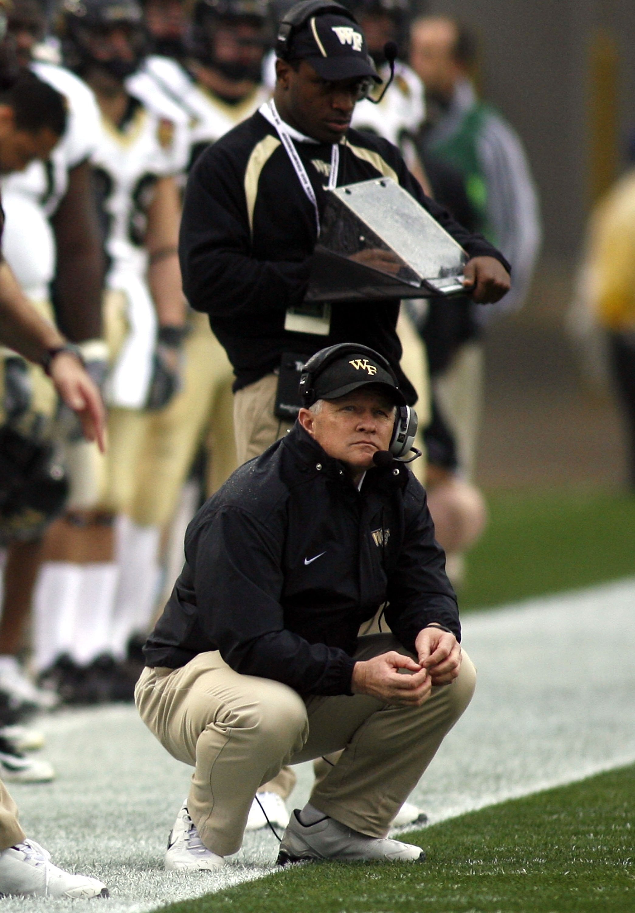JACKSONVILLE, FL - DECEMBER 02:  Head coach Jim Grobe of the Wake Forest Demon Deacons keels on the sidelines during a game against the Georgia Tech Yellow Jackets during the Atlantic Coast Conference Championship on December 2, 2006 at Alltel Stadium in