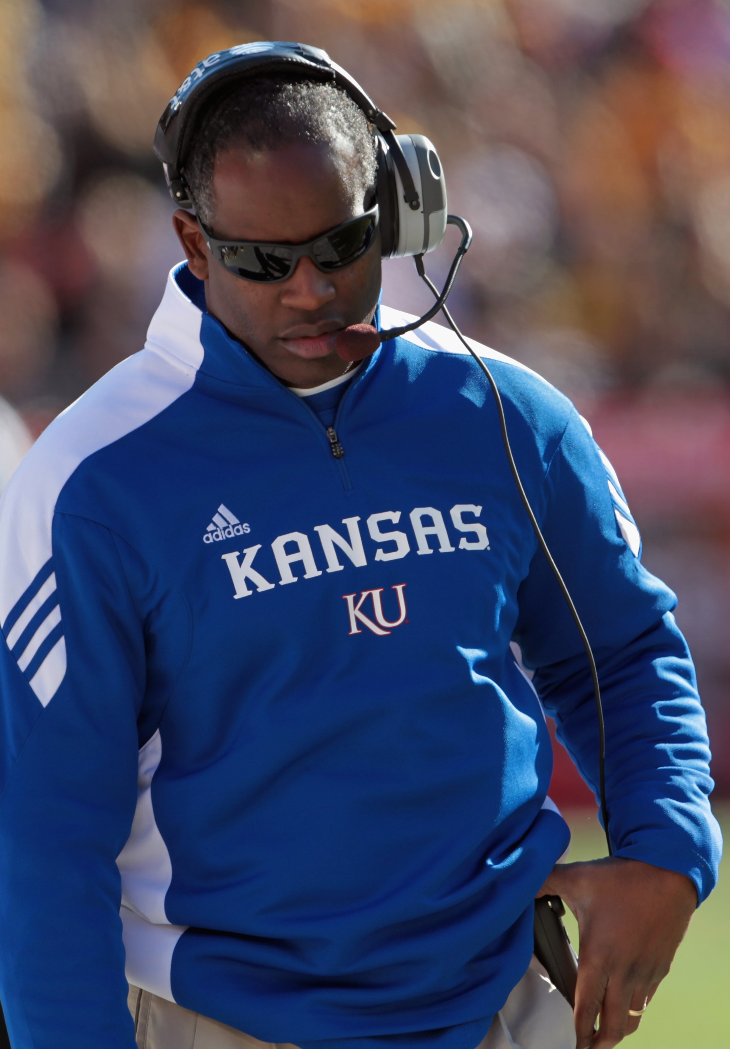 KANSAS CITY, MO - NOVEMBER 27:  Head coach Turner Gill of the Kansas Jayhawks coaches from the sidelines during the game against the Missouri Tigers on November 27, 2010 at Arrowhead Stadium in Kansas City, Missouri.  (Photo by Jamie Squire/Getty Images)