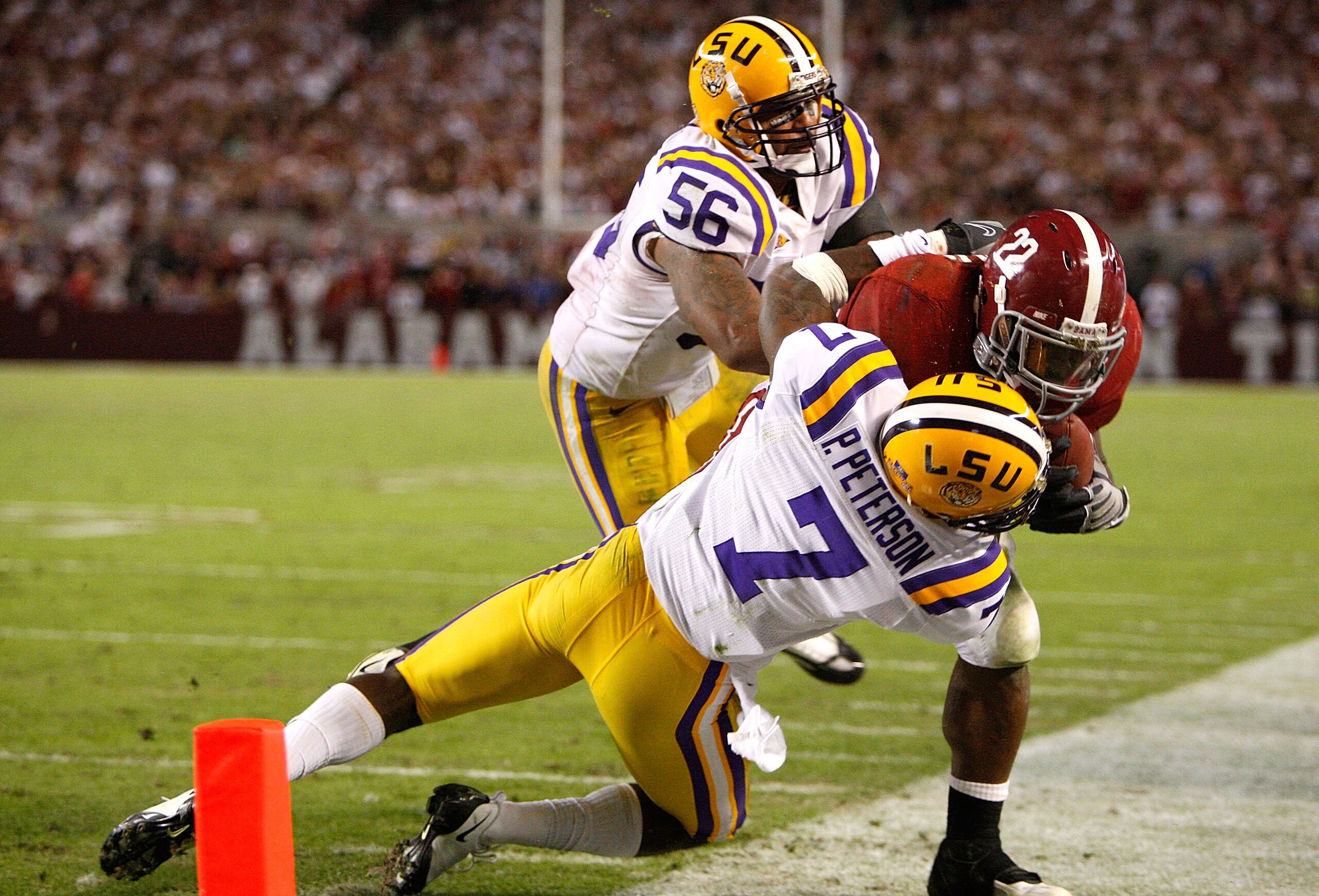 TUSCALOOSA, AL - NOVEMBER 07:  Patrick Peterson #7 of the Louisiana State University Tigers tackles Mark Ingram #22 of the Alabama Crimson Tide at Bryant-Denny Stadium on November 7, 2009 in Tuscaloosa, Alabama.  (Photo by Kevin C. Cox/Getty Images)
