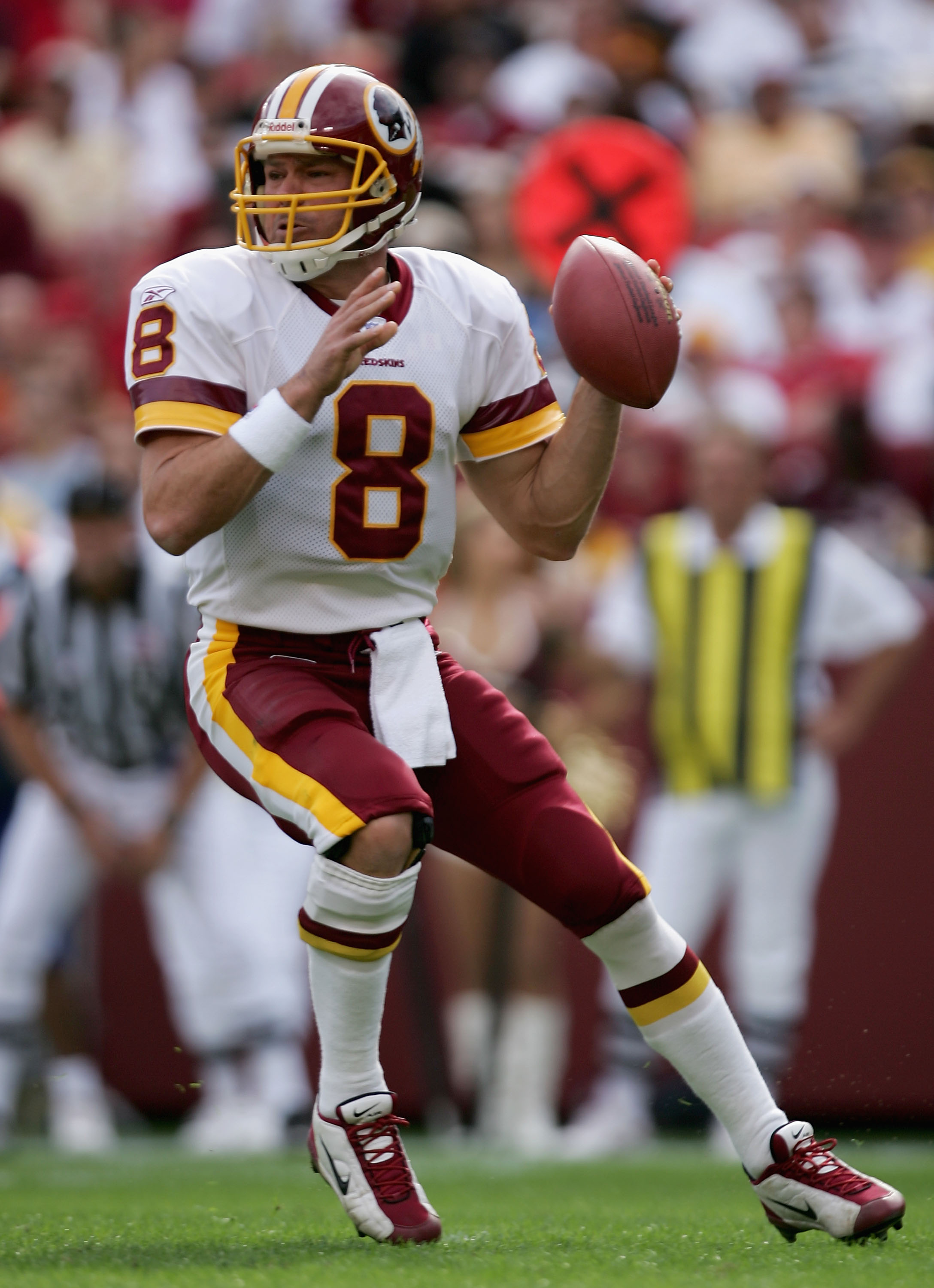 LANDOVER, MD - OCTOBER 31:  Quarterback Mark Brunell #8 of the Washington Redskins looks for a receiver against the Green Bay Packers as the Packers defeated the Redskins 28-14 at FedEx Field on October 31, 2004 in Landover, Maryland. (Photo by Doug Pensi