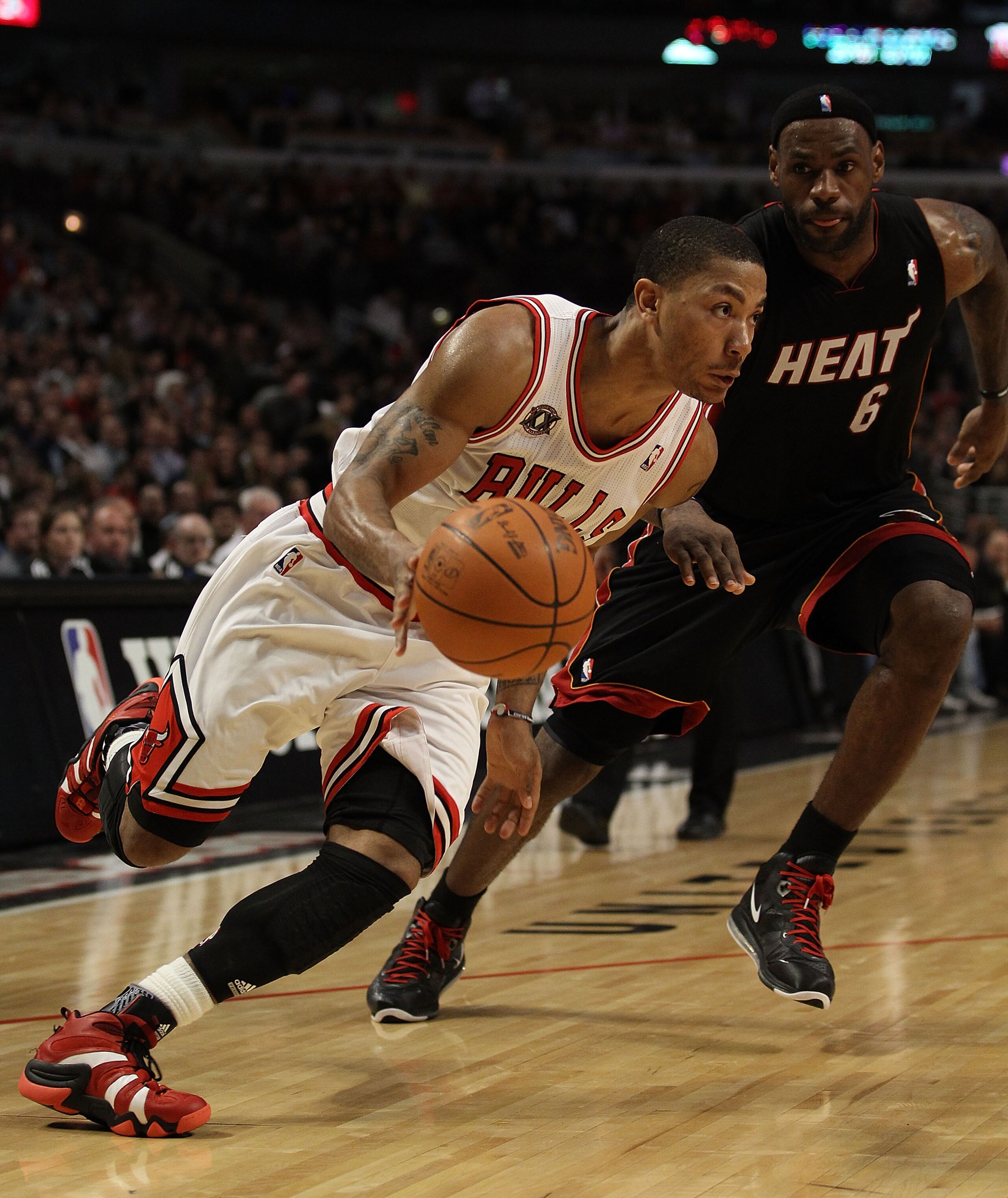 CHICAGO, IL - FEBRUARY 24: Derrick Rose #1 of the Chicago Bulls drives past LeBron James #6 of the Miami Heat at the United Center on February 24, 2011 in Chicago, Illinois. The Bulls defeated the Heat 93-89. NOTE TO USER: User expressly acknowledges and CHICAGO, IL - FEBRUARY 24: Derrick Rose #1 of the Chicago Bulls drives past LeBron James #6 of the Miami Heat at the United Center on February 24, 2011 in Chicago, Illinois. The Bulls defeated the Heat 93-89. NOTE TO USER: User expressly acknowledges and