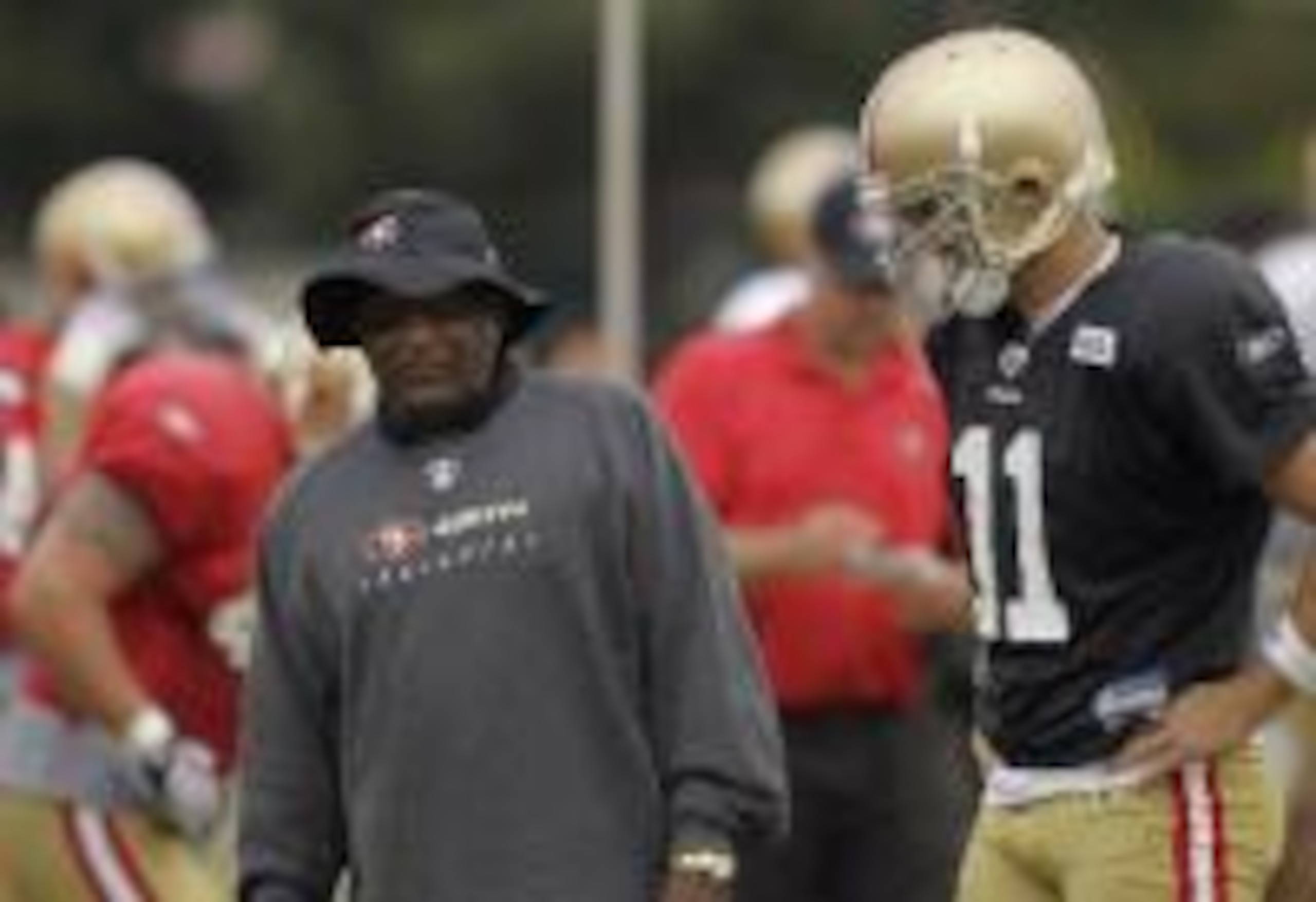 Jimmy Raye took the job as 49ers' offensive coordinator after Smith suffered a shoulder injury.