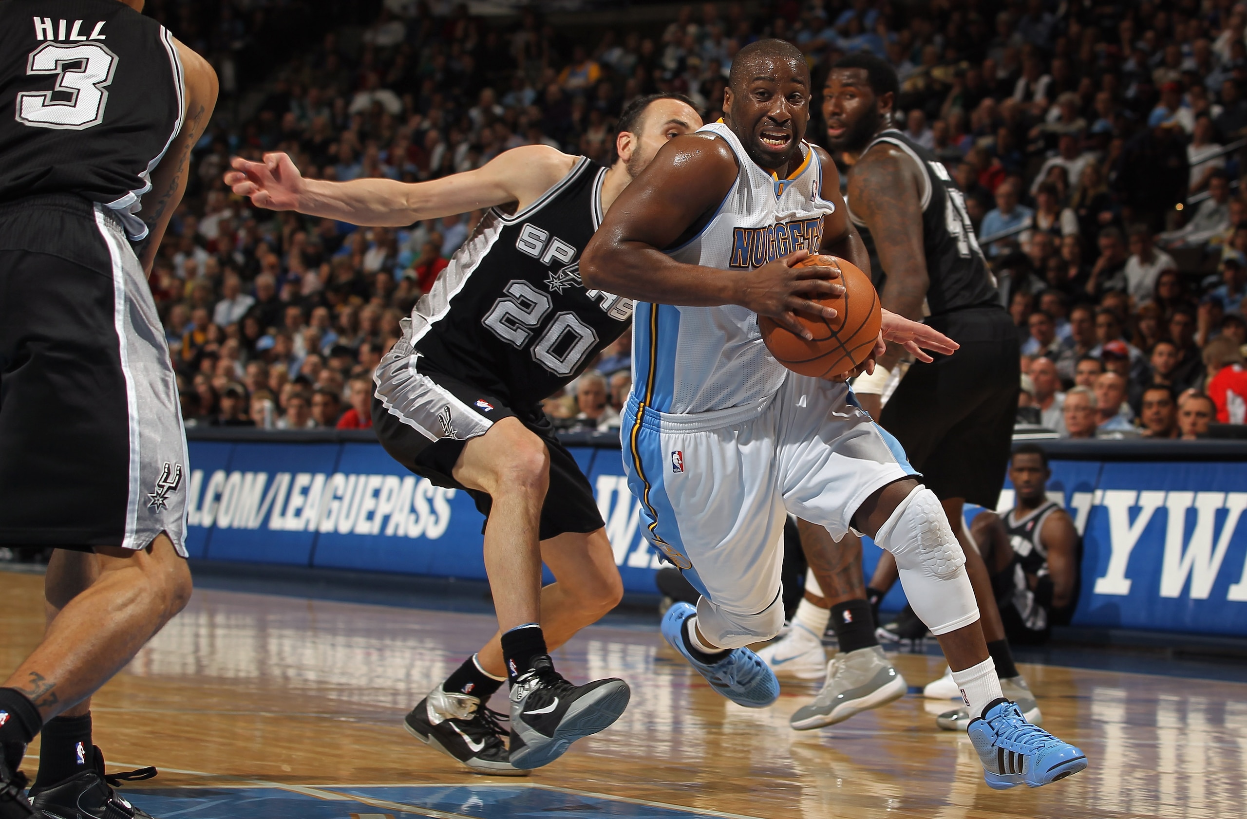 DENVER, CO - MARCH 23: Raymond Felton #20 of the Denver Nuggets drives past Manu Ginobili #20 of the San Antonio Spurs at the Pepsi Center on March 23, 2011 in Denver, Colorado. The Nuggets defeated the Spurs 115-112. NOTE TO USER: User expressly acknowl DENVER, CO - MARCH 23: Raymond Felton #20 of the Denver Nuggets drives past Manu Ginobili #20 of the San Antonio Spurs at the Pepsi Center on March 23, 2011 in Denver, Colorado. The Nuggets defeated the Spurs 115-112. NOTE TO USER: User expressly acknowl