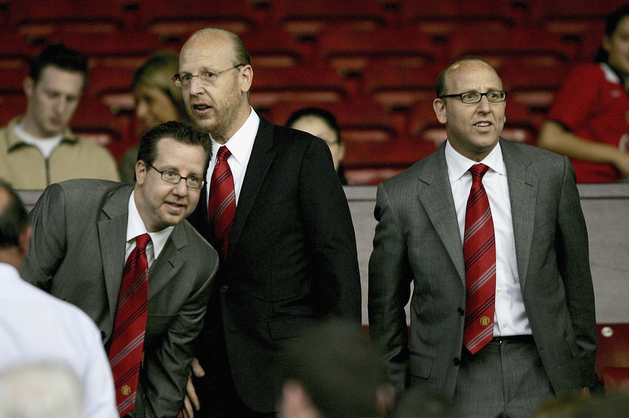 MANCHESTER, ENGLAND-AUGUST 9 : (L to R) Joel Glazer, Avram Glazer and Bryan Glazer, sons of owner Malcolm Glazer, are seen before the Champions League third qualifying round, first leg match between Manchester United and Debreceni VSC at Old Trafford on A