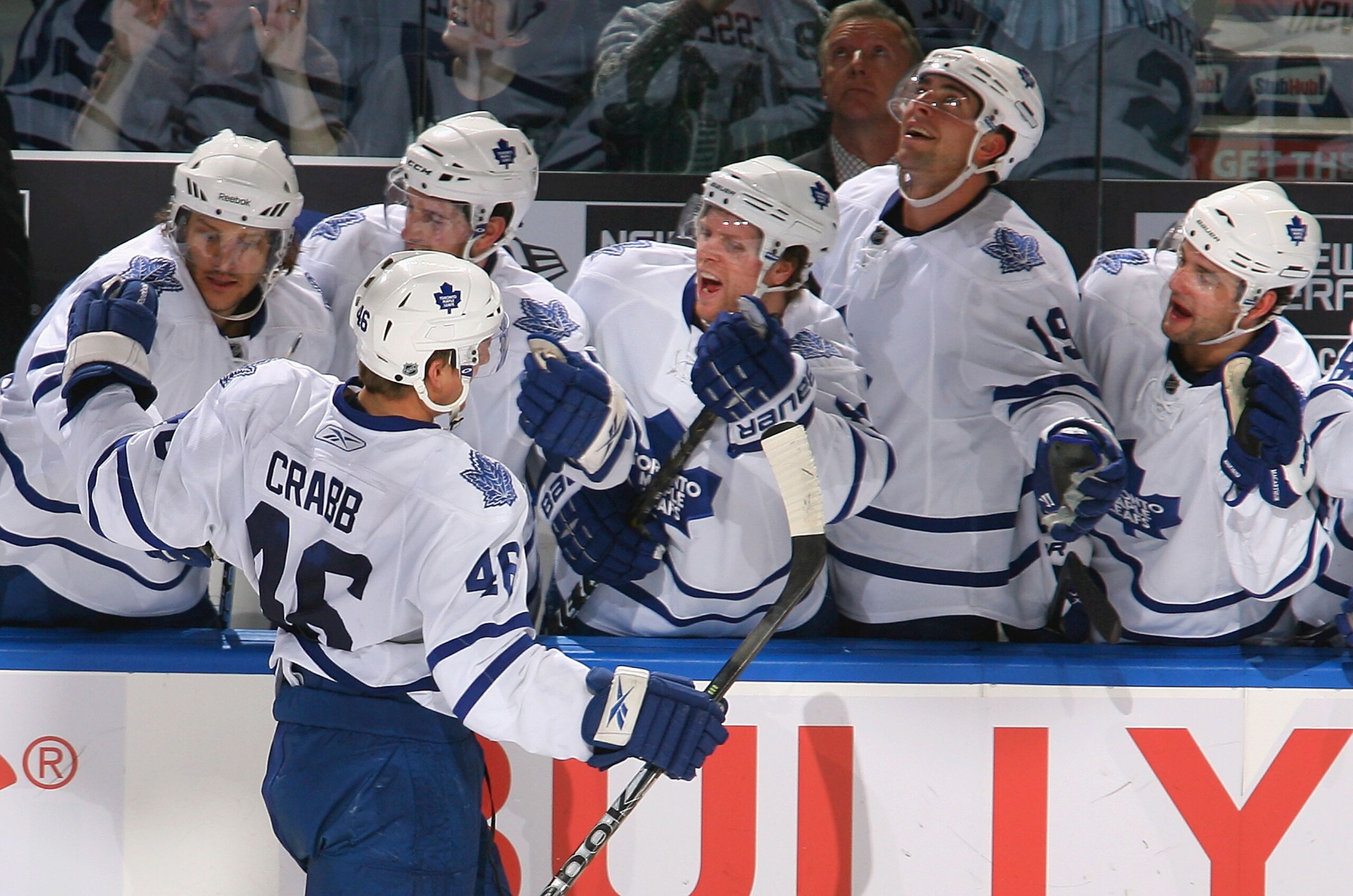 BUFFALO, NY - FEBRUARY 16: Joey Crabb #46 of the Toronto Maple Leafs celebrates scoring the game-winning goal with his teammates against the Buffalo Sabres at HSBC Arena on February 16, 2011 in Buffalo, New York. Toronto won 2-1. (Photo by Rick Stewart/G BUFFALO, NY - FEBRUARY 16: Joey Crabb #46 of the Toronto Maple Leafs celebrates scoring the game-winning goal with his teammates against the Buffalo Sabres at HSBC Arena on February 16, 2011 in Buffalo, New York. Toronto won 2-1. (Photo by Rick Stewart/G