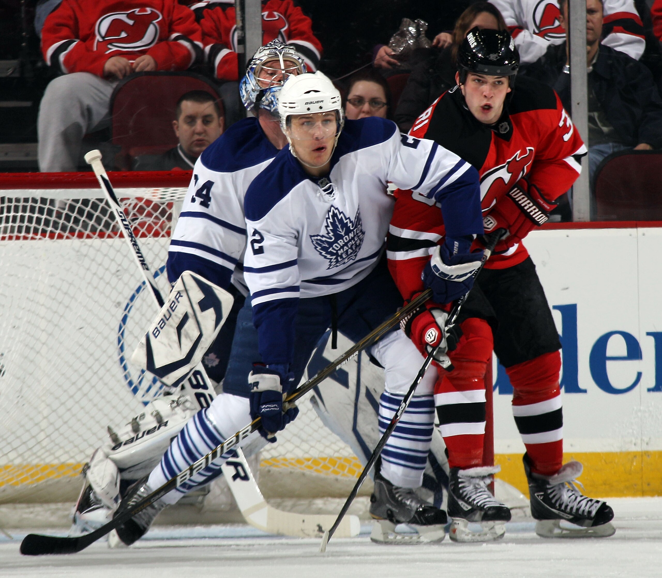 NEWARK, NJ - APRIL 06: Luke Schenn #2 of the Toronto Maple Leafs and Nick Palmieri #32 of the New Jersey Devils battle in front of the net at the Prudential Center on April 6, 2011 in Newark, New Jersey. (Photo by Bruce Bennett/Getty Images) NEWARK, NJ - APRIL 06: Luke Schenn #2 of the Toronto Maple Leafs and Nick Palmieri #32 of the New Jersey Devils battle in front of the net at the Prudential Center on April 6, 2011 in Newark, New Jersey. (Photo by Bruce Bennett/Getty Images)