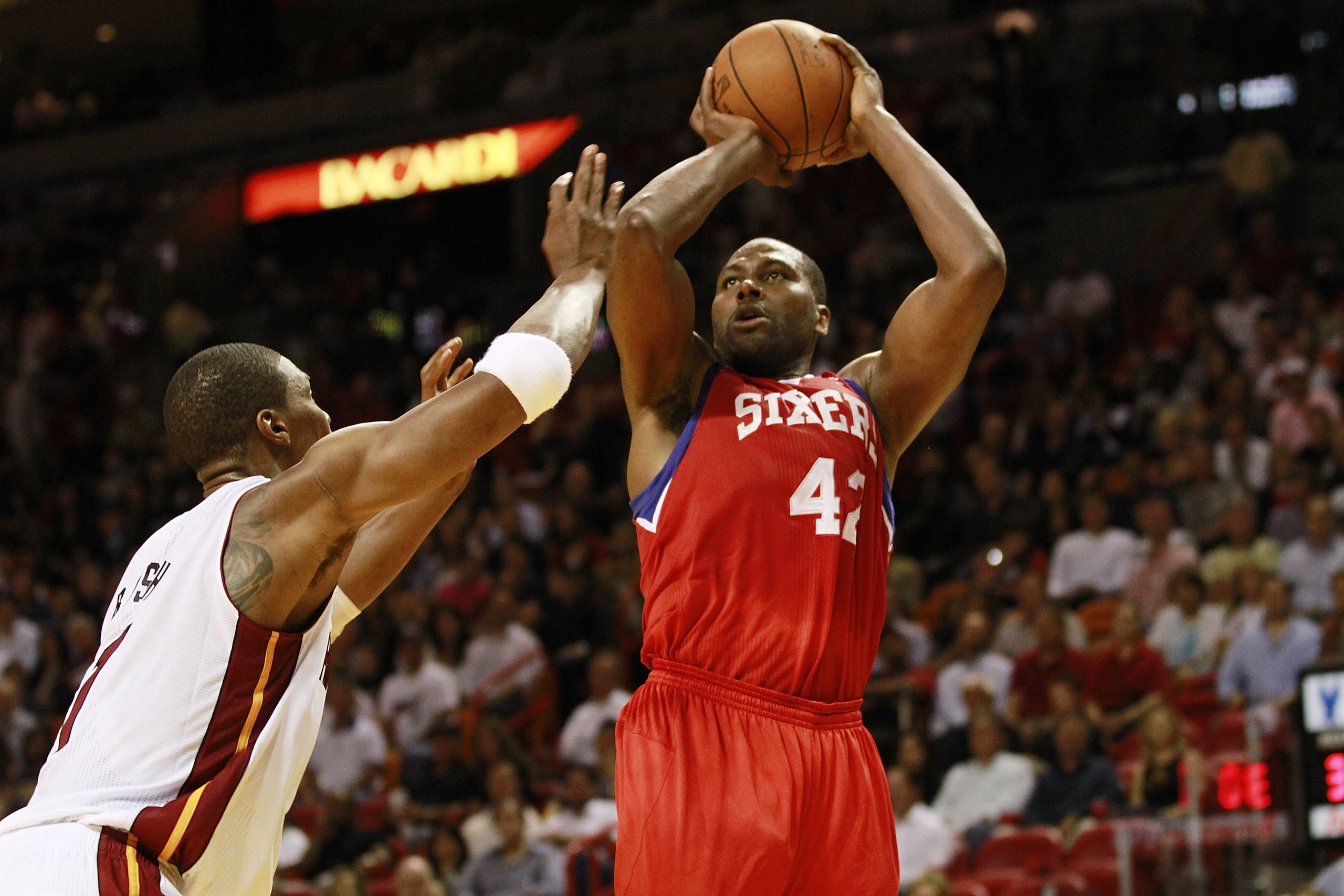 MIAMI, FL - MARCH 25: Guard Elton Brand #42 of the Philadelphia Sixers shoots against the Miami Heat at American Airlines Arena on March 25, 2011 in Miami, Florida. The Heat defeated the Sixers 111-99. NOTE TO USER: User expressly acknowledges and agrees MIAMI, FL - MARCH 25: Guard Elton Brand #42 of the Philadelphia Sixers shoots against the Miami Heat at American Airlines Arena on March 25, 2011 in Miami, Florida. The Heat defeated the Sixers 111-99. NOTE TO USER: User expressly acknowledges and agrees