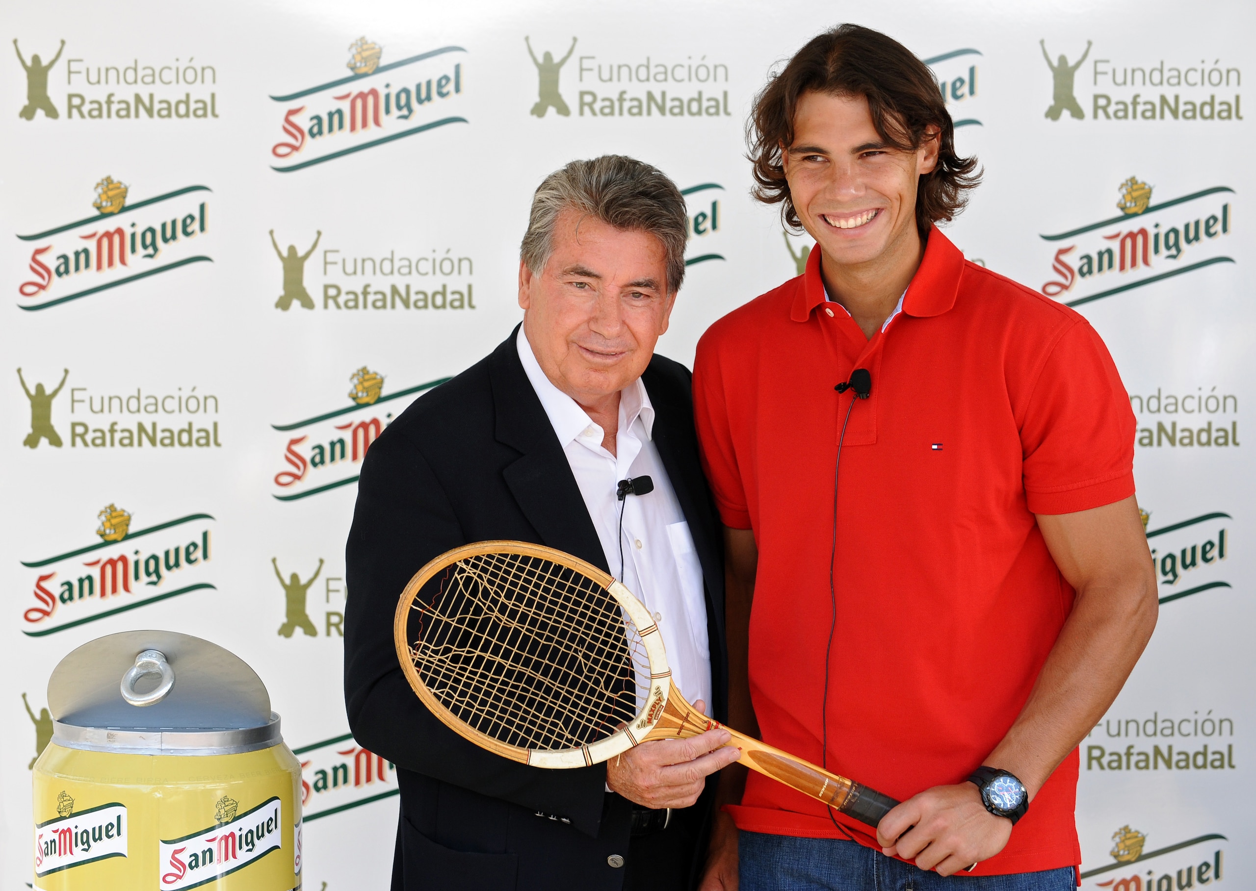 BARCELONA, SPAIN - APRIL 21:  Former tennis great Manolo Santana (L) and Rafael Nadal hold a racket used by Santana in the year he won the Wimbledon Championships during a promotional event for Nadal's foundation on day two of the ATP 500 World Tour Barce
