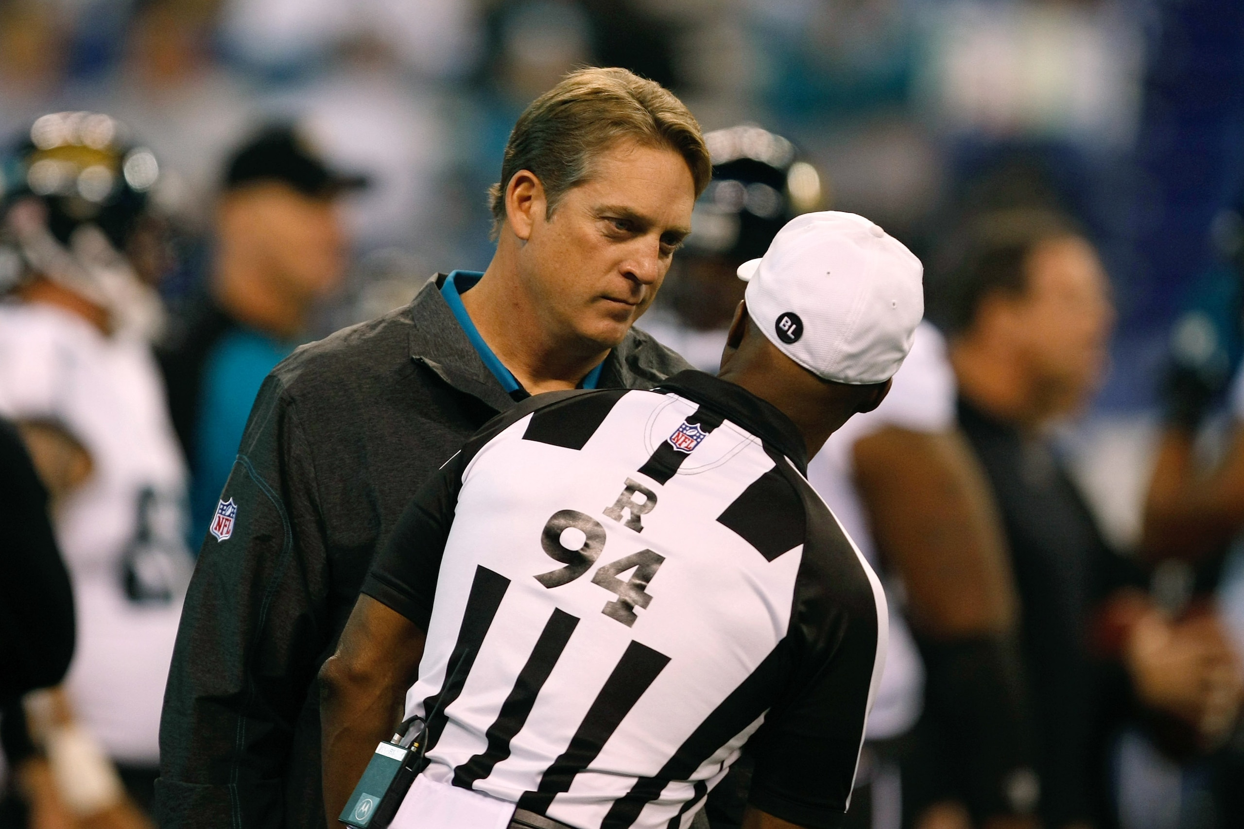 INDIANAPOLIS, IN - DECEMBER 19: Jack Del Rio of the Jacksonville Jaguars talks with Mike Carey #94 during pregame warm ups prior to the game against the Indianapolis Colts at Lucas Oil Stadium on December 19, 2010 in Indianapolis, Indiana.  (Photo by Scot