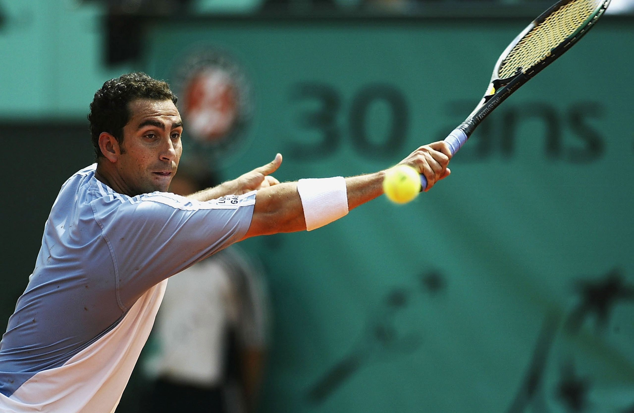 PARIS, FRANCE - JUNE 4:  Albert Costa of Spain returns in his quarter final match against Tommy Robredo of Spain during the tenth day of the French Open on June 4, 2003 at Roland Garros in Paris, France. (Photo by Clive Mason/Getty Images)