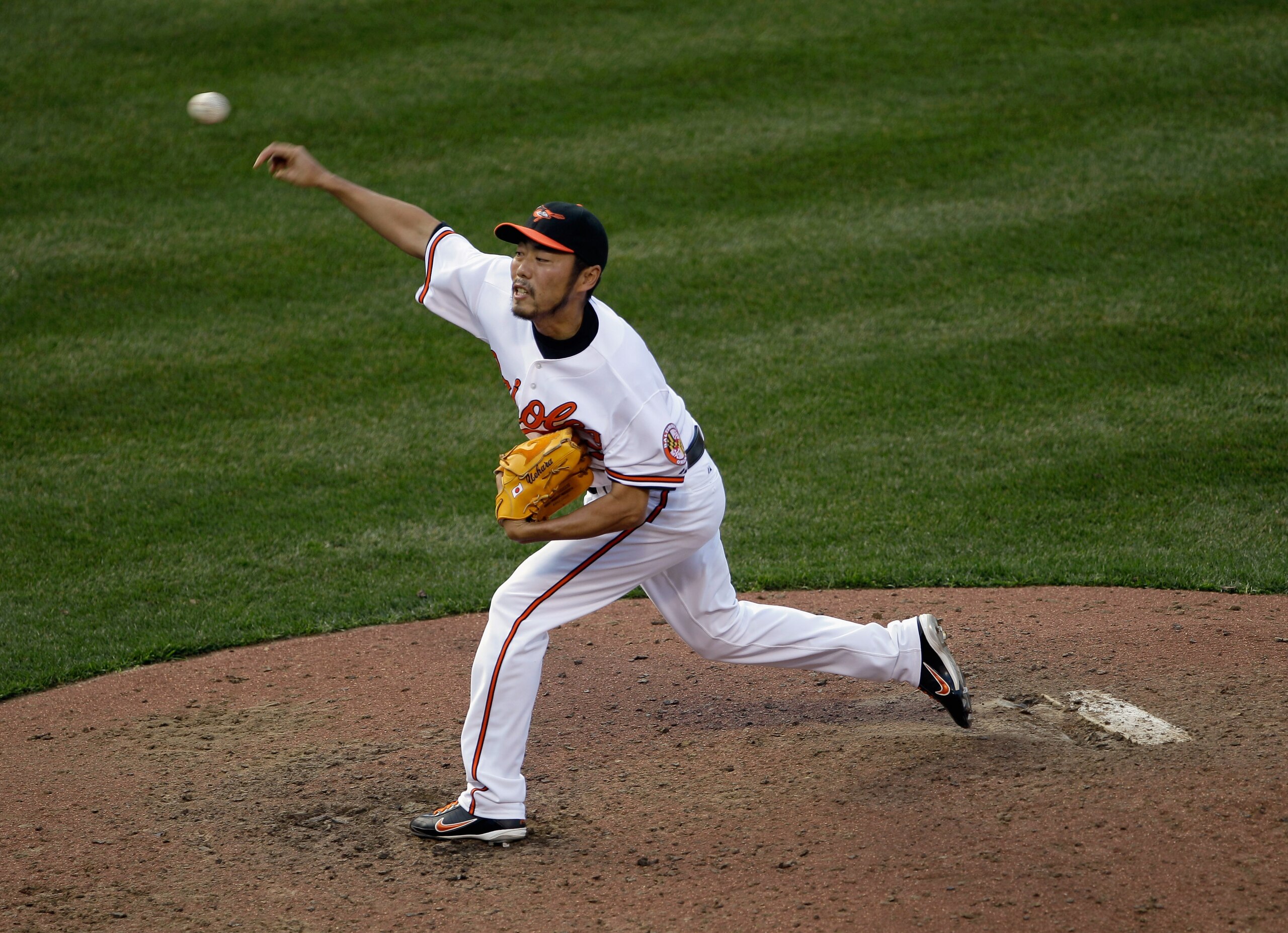 BALTIMORE, MD - APRIL 04:  Reliever Koji Uehara #19 of the Baltimore Orioles delivers to a Detroit Tigers batter during the ninth inning during opening day at Oriole Park at Camden Yards on April 4, 2011 in Baltimore, Maryland.  (Photo by Rob Carr/Getty I