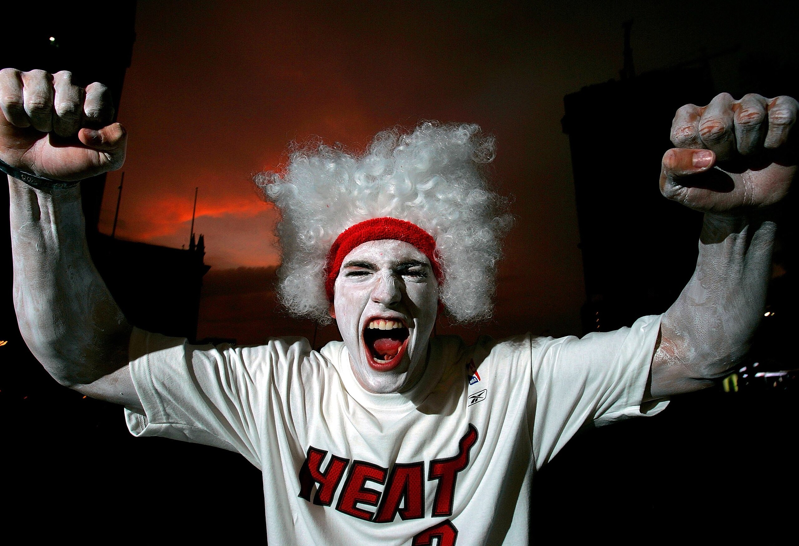 MIAMI - JUNE 15:  Miami Heat fan Bryant Whelan gestures as he shows his support for the team by wearing all white before game 4 of the NBA Finals between Dallas Mavericks v Miami Heat on June 15 in Miami, Florida. The team has asked fans to wear all white