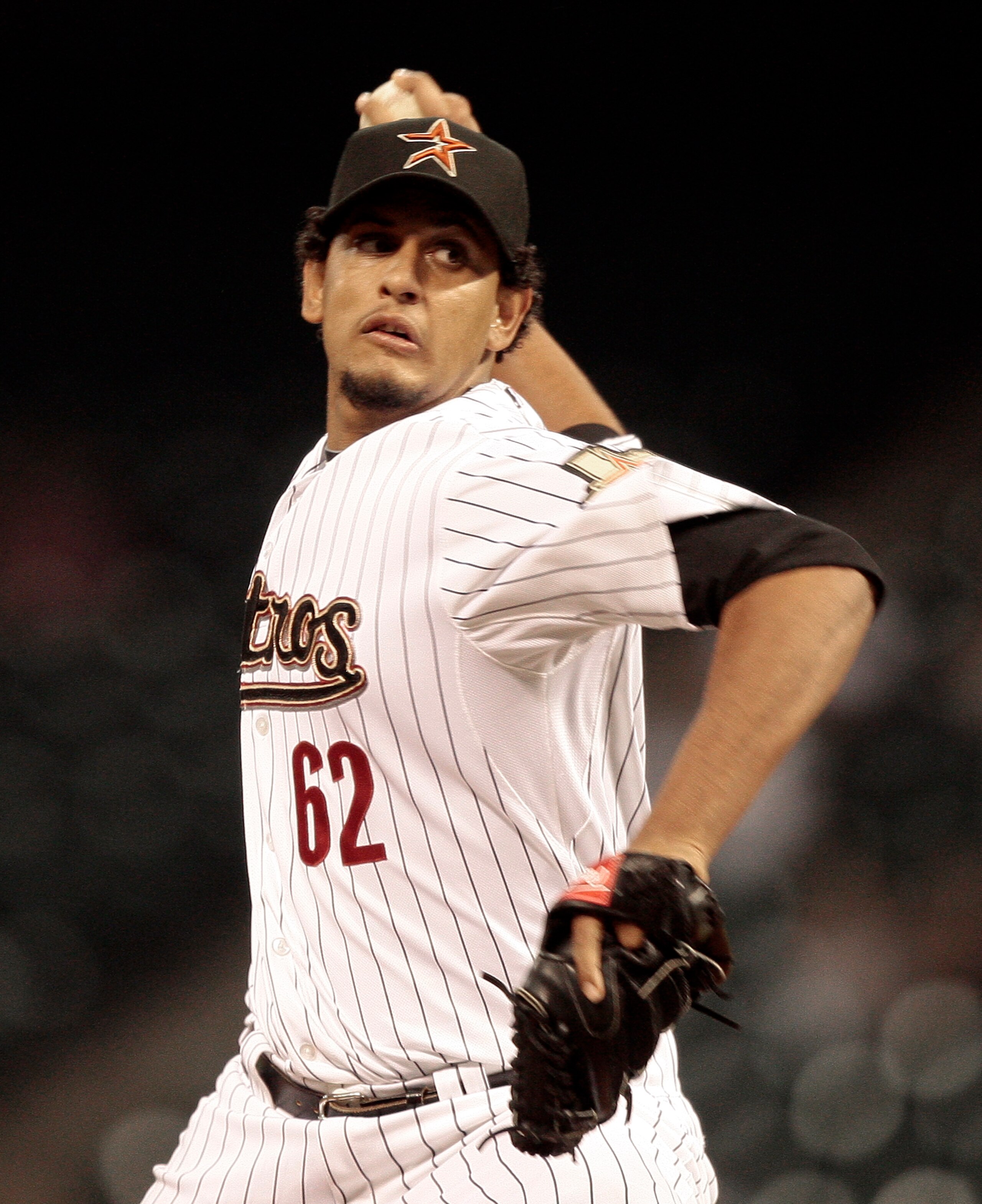 HOUSTON - APRIL 12:  Pitcher Aneury Rodriguez #62 throws in the ninth inning against the Chicago Cubs at Minute Maid Park on April 12, 2011 in Houston, Texas. Rodriguez was suspended for three games for hitting a batter during the Florida series.Rodriguez