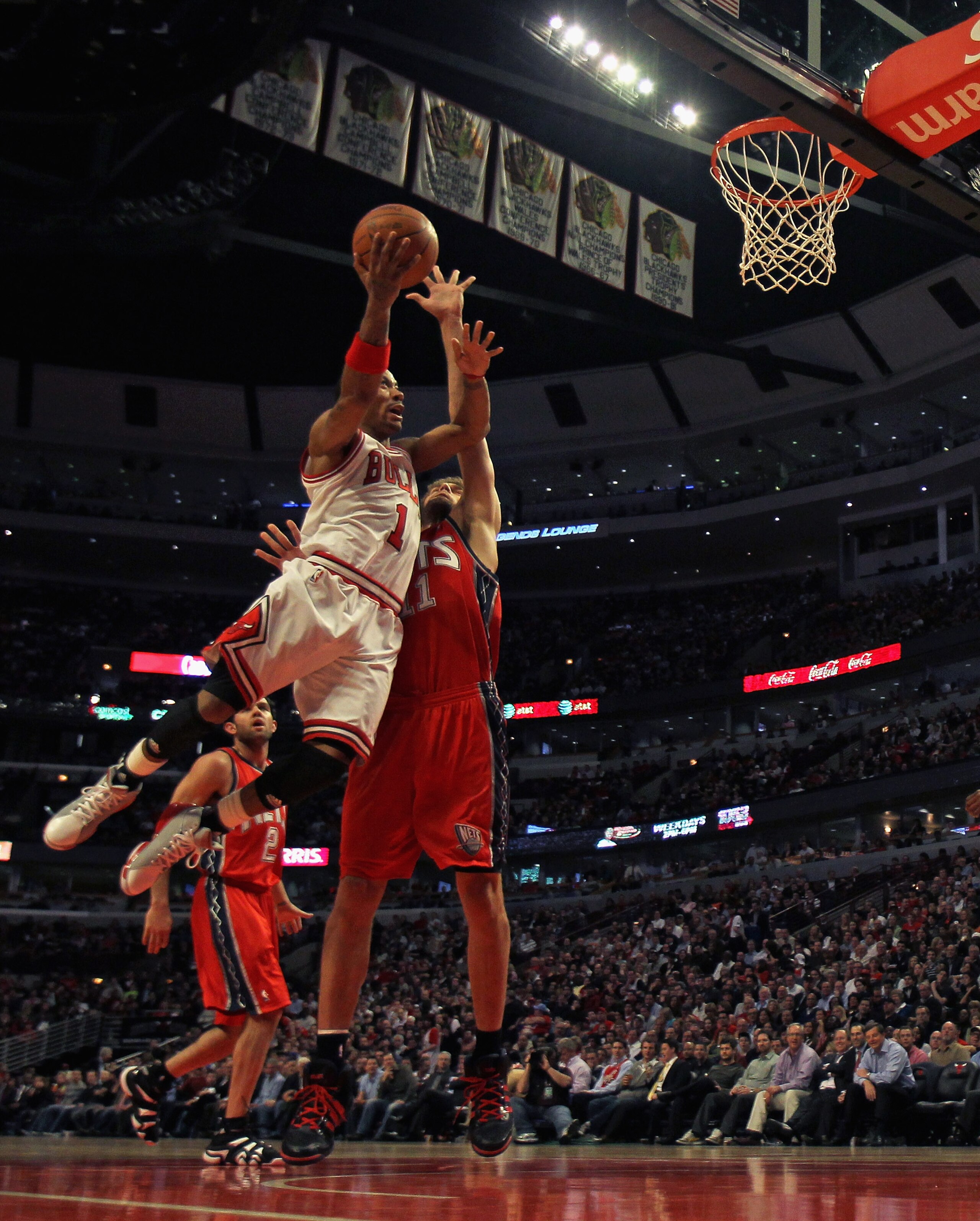 CHICAGO, IL - APRIL 13: Derrick Rose #1 of the Chicago Bulls puts up a shot against Brook Lopez #11 of the New Jersey Nets at the United Center on April 13, 2011 in Chicago, Illinois. The Bulls defeated the Nets 97-92. NOTE TO USER: User expressly acknowl CHICAGO, IL - APRIL 13: Derrick Rose #1 of the Chicago Bulls puts up a shot against Brook Lopez #11 of the New Jersey Nets at the United Center on April 13, 2011 in Chicago, Illinois. The Bulls defeated the Nets 97-92. NOTE TO USER: User expressly acknowl