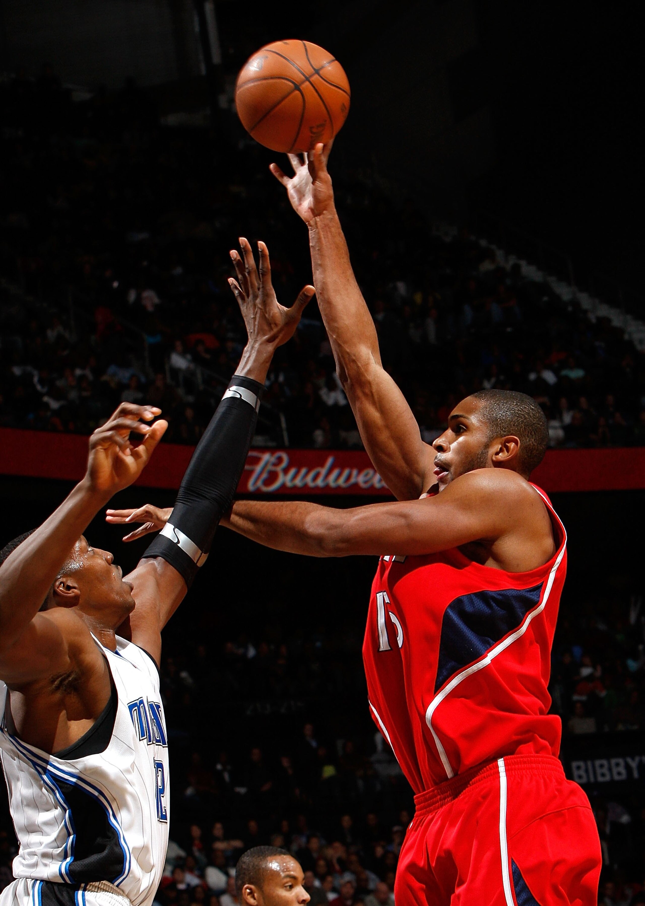 ATLANTA - NOVEMBER 26:  Al Horford #15 of the Atlanta Hawks against Dwight Howard #12 of the Orlando Magic at Philips Arena on November 26, 2009 in Atlanta, Georgia.  NOTE TO USER: User expressly acknowledges and agrees that, by downloading and/or using t