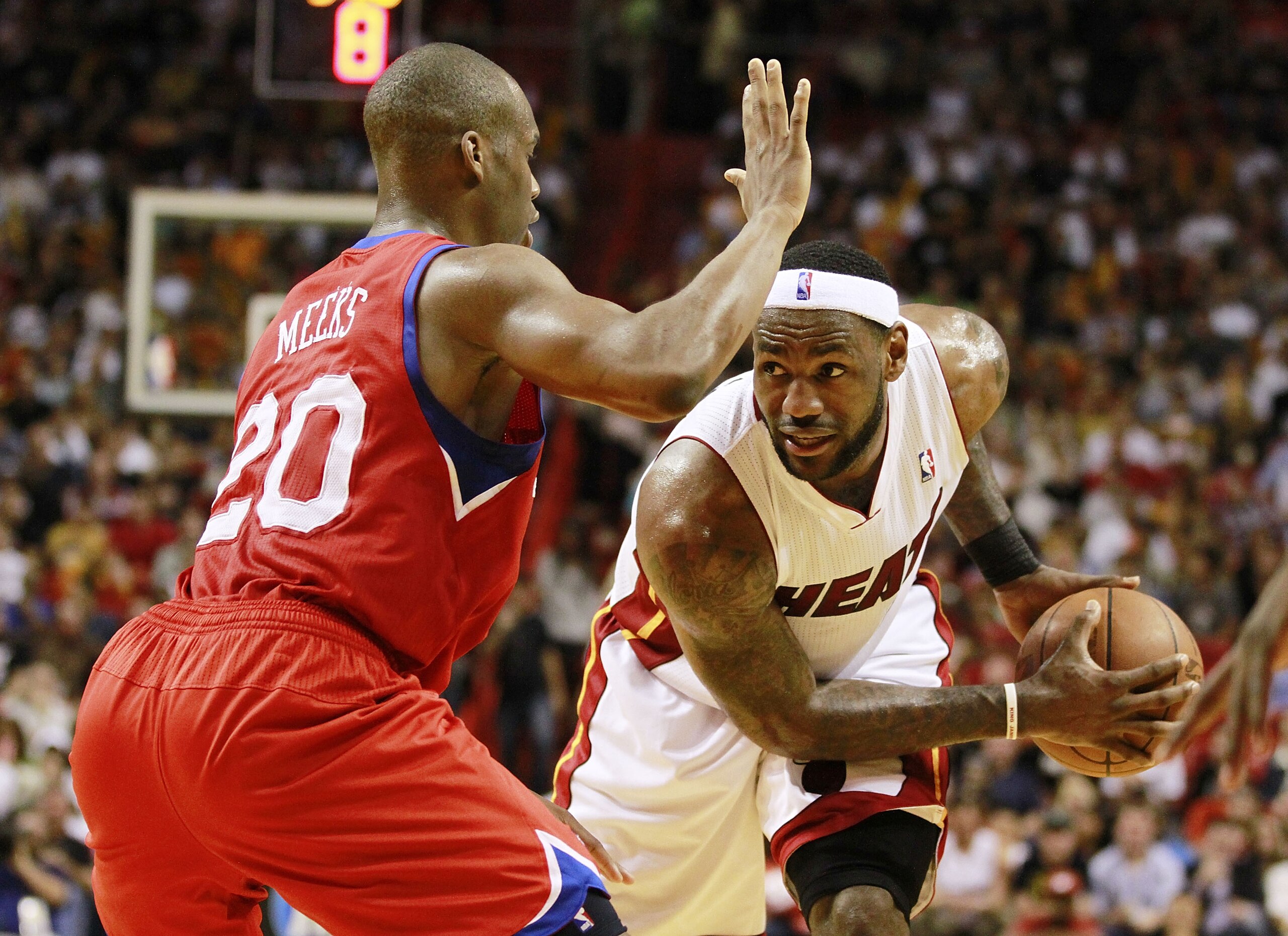 MIAMI, FL - MARCH 25: Forward LeBron James #6 of the Miami Heat drives against Guard Jodie Meeks #20 of the Philadelphia 76ers at American Airlines Arena on March 25, 2011 in Miami, Florida. The Heat defeated the Sixers 111-99. NOTE TO USER: User expres MIAMI, FL - MARCH 25: Forward LeBron James #6 of the Miami Heat drives against Guard Jodie Meeks #20 of the Philadelphia 76ers at American Airlines Arena on March 25, 2011 in Miami, Florida. The Heat defeated the Sixers 111-99. NOTE TO USER: User expres