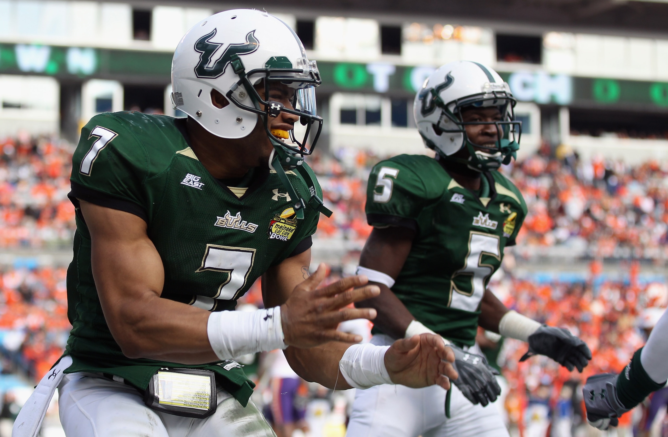 CHARLOTTE, NC - DECEMBER 31: B.J. Daniels #7 of the USF Bulls celebrates after scoring a touchdown against the Clemson Tigers during their game at Bank of America Stadium on December 31, 2010 in Charlotte, North Carolina. (Photo by Streeter Lecka/Getty CHARLOTTE, NC - DECEMBER 31: B.J. Daniels #7 of the USF Bulls celebrates after scoring a touchdown against the Clemson Tigers during their game at Bank of America Stadium on December 31, 2010 in Charlotte, North Carolina. (Photo by Streeter Lecka/Getty