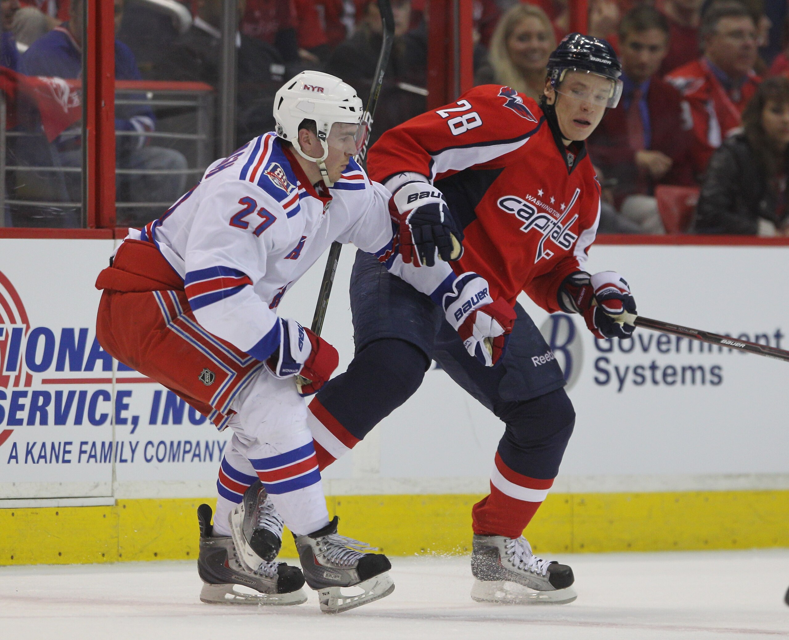 WASHINGTON, DC - APRIL 13:  Ryan McDonagh #27 of the New York Rangers checks Alexander Semin #28 of the Washington Capitals in Game One of the Eastern Conference Quarterfinals during the 2011 NHL Stanley Cup Playoffs at Verizon Center on April 13, 2011 in