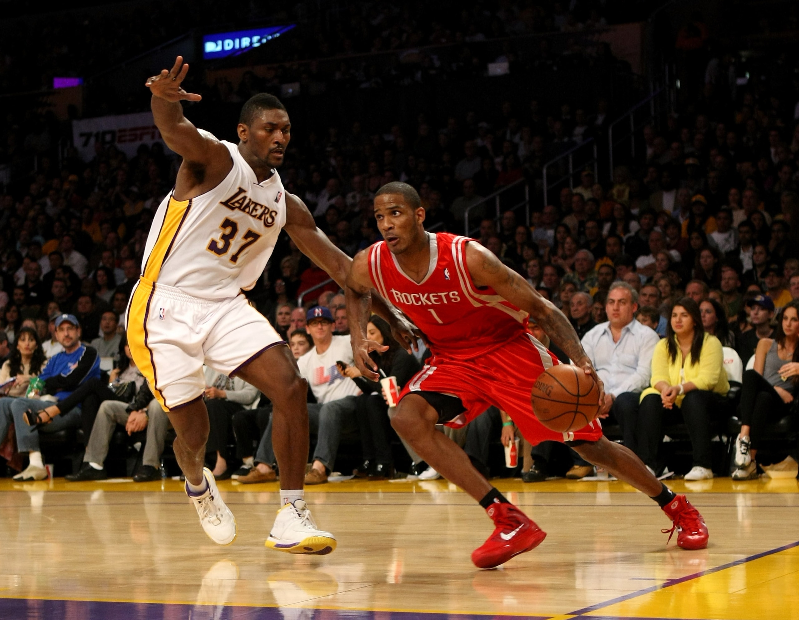 LOS ANGELES, CA - NOVEMBER 15:  Trevor Ariza #1 of  the Houston Rockets drives against Ron Artest #37 of the Los Angeles Lakers on November 15, 2009 at Staples Center in Los Angeles, California.  The Rockets won 101-91.  NOTE TO USER: User expressly ackno