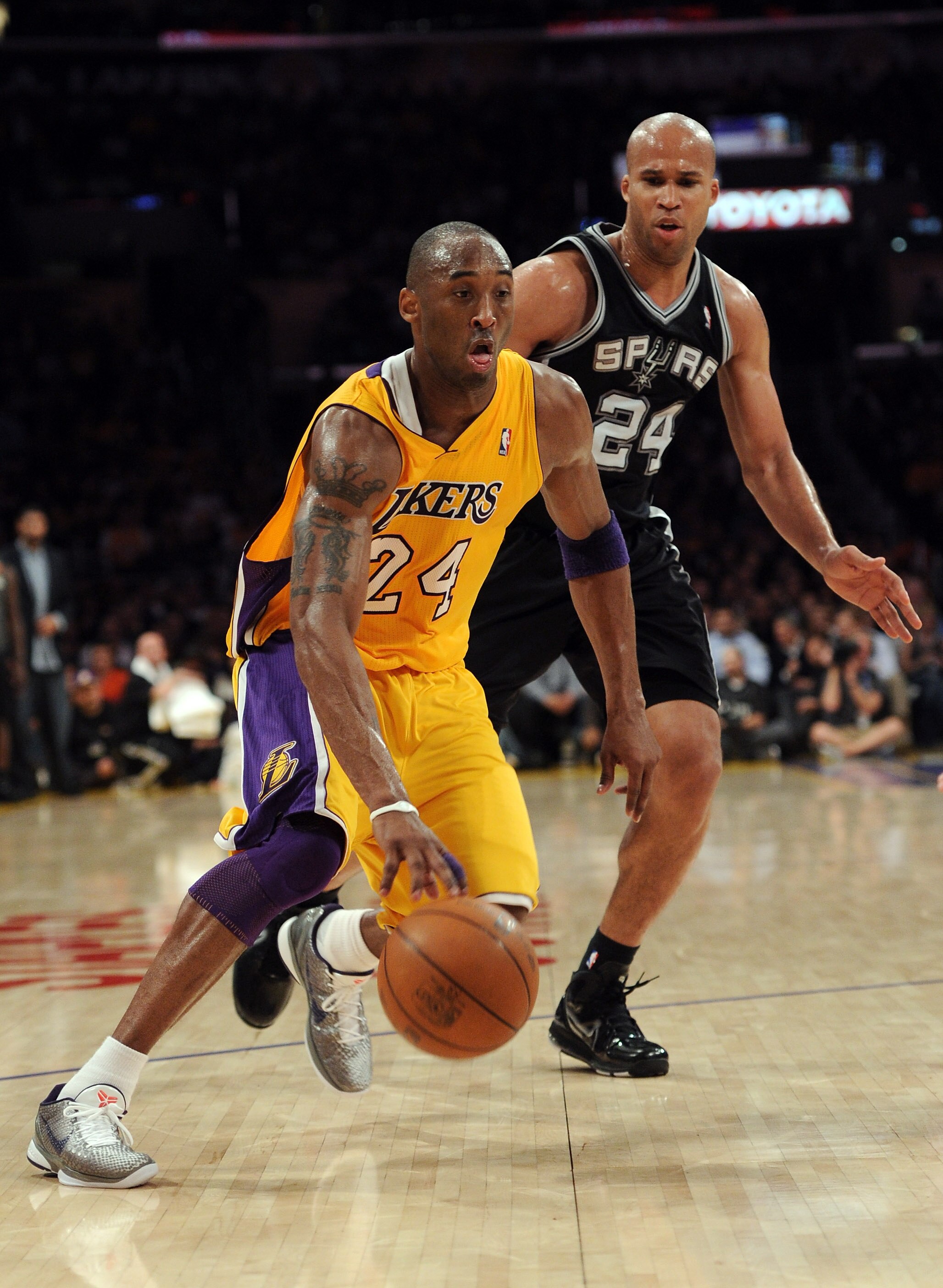 LOS ANGELES, CA - APRIL 12:  Kobe Bryant #24 of the Los Angeles Lakers drives on Richard Jefferson #24 of the San Antonio Spurs at Staples Center on April 12, 2011 in Los Angeles, California.  NOTE TO USER: User expressly acknowledges and agrees that, by