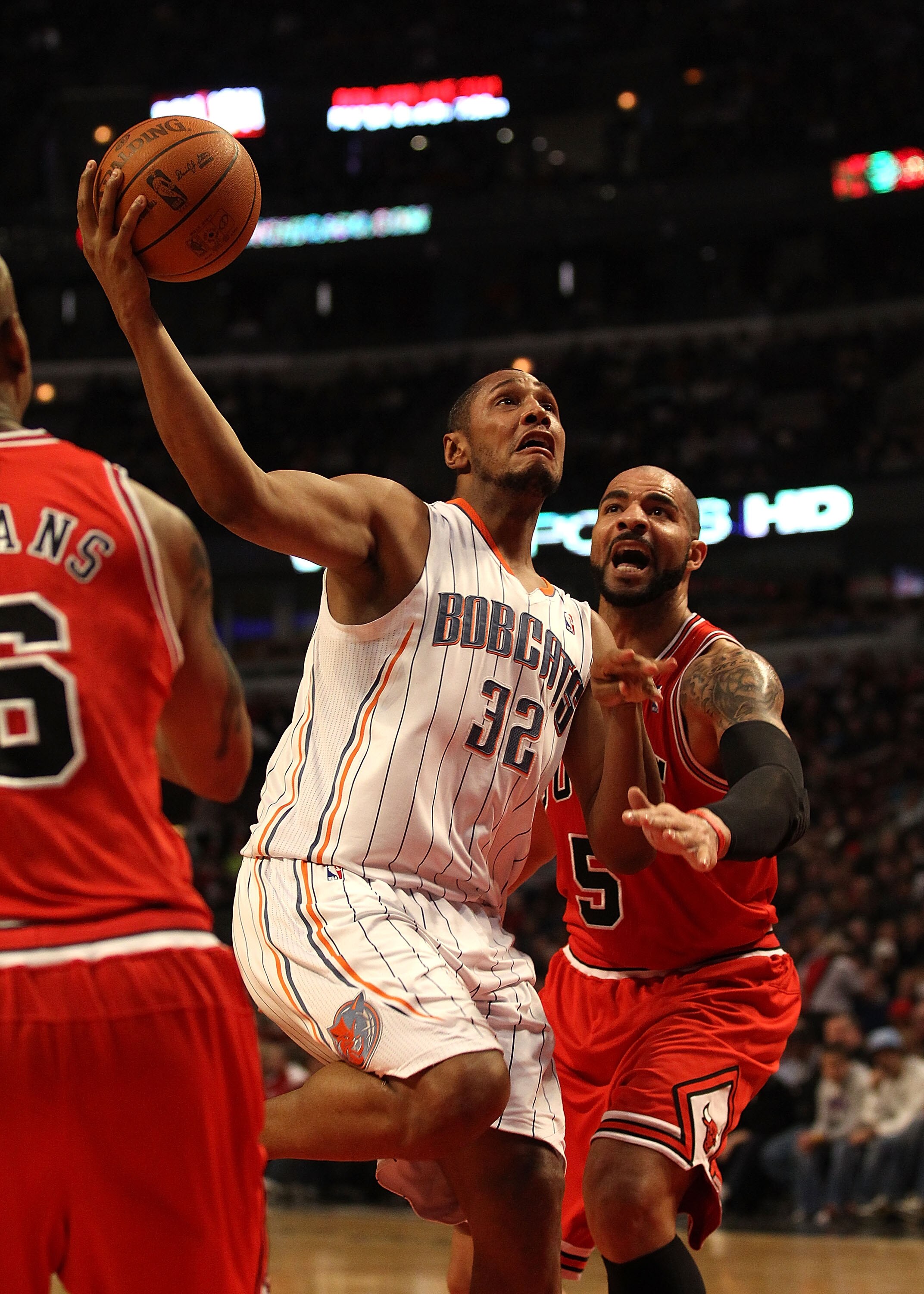 CHICAGO, IL - FEBRUARY 15: Boris Diaw #32 of the Charlotte Bobcats moves to the basket past Carlos Boozer #5 of the Chicago Bulls at the United Center on February 15, 2011 in Chicago, Illinois. NOTE TO USER: User expressly acknowledges and agrees that, by