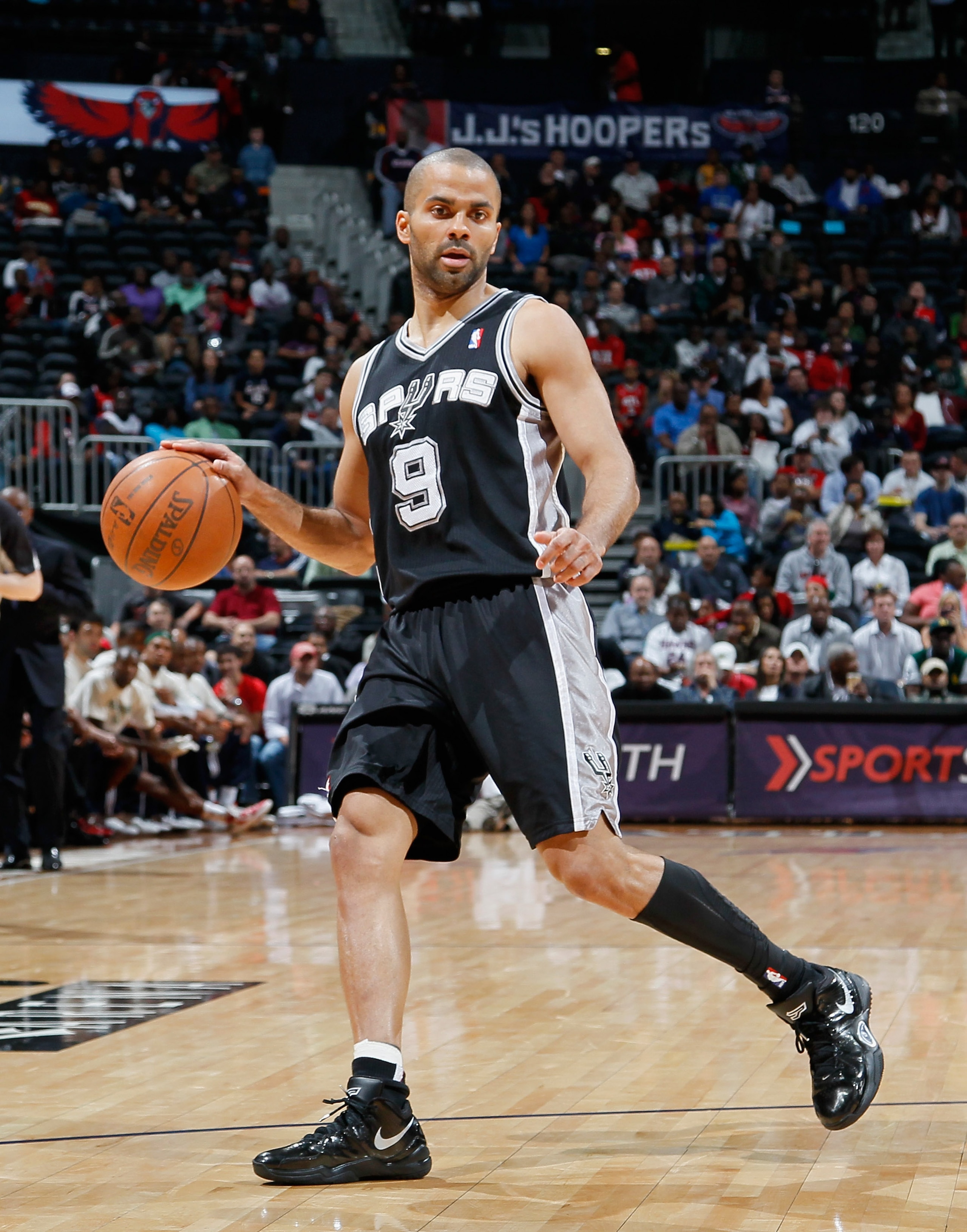 ATLANTA, GA - APRIL 05: Tony Parker #9 of the San Antonio Spurs against the Atlanta Hawks at Philips Arena on April 5, 2011 in Atlanta, Georgia. NOTE TO USER: User expressly acknowledges and agrees that, by downloading and/or using this Photograph, user ATLANTA, GA - APRIL 05: Tony Parker #9 of the San Antonio Spurs against the Atlanta Hawks at Philips Arena on April 5, 2011 in Atlanta, Georgia. NOTE TO USER: User expressly acknowledges and agrees that, by downloading and/or using this Photograph, user