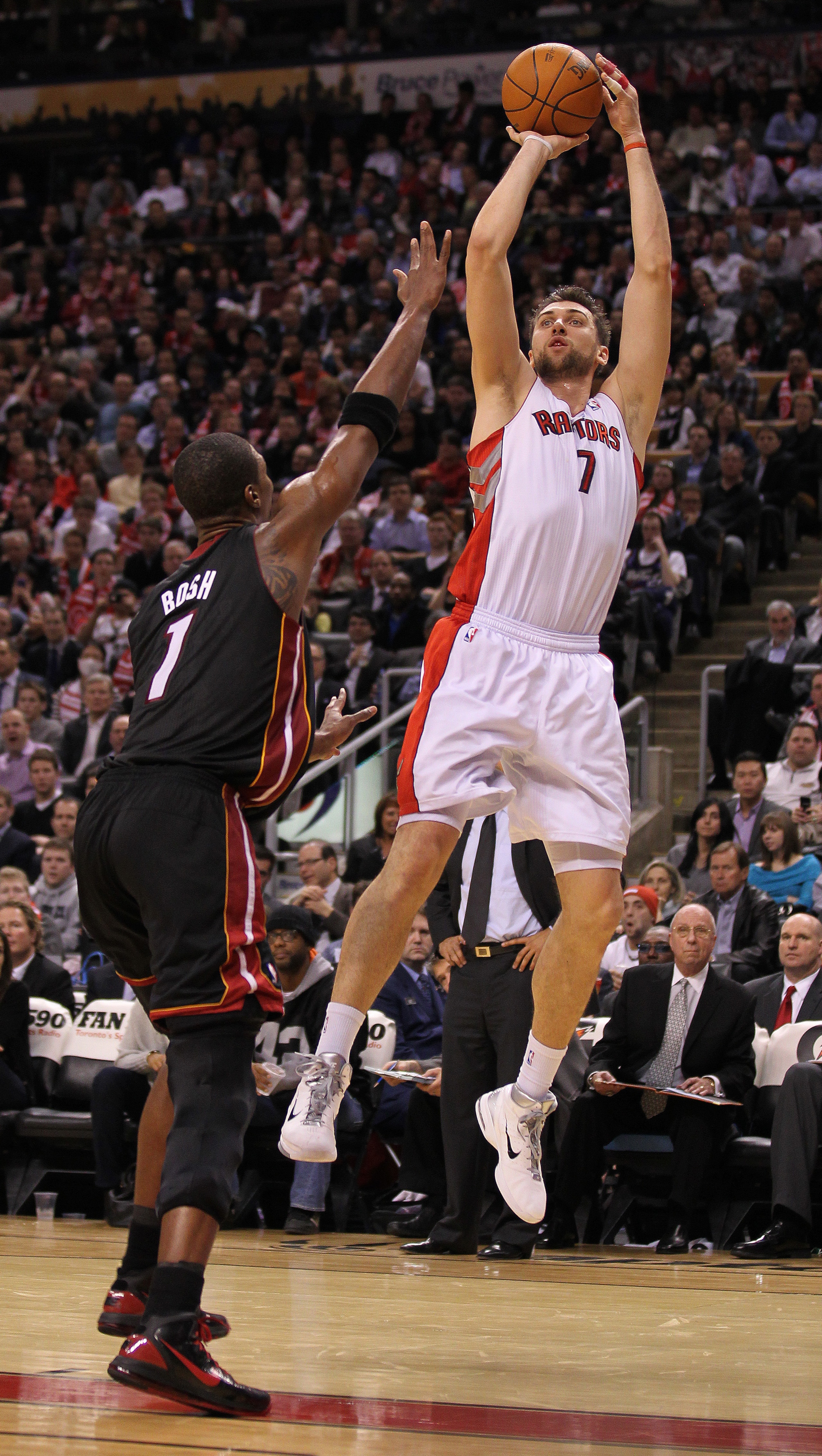 TORONTO, CAN - FEBRUARY 16: Andrea Bargnani #7 of the Toronto Raptors shoots over Chris Bosh #1 of the Miami Heat in a game on February 16, 2011 at the Air Canada Centre in Toronto, Canada. The Heat defeated the Raptors 103-95. (Photo by Claus Andersen/G TORONTO, CAN - FEBRUARY 16: Andrea Bargnani #7 of the Toronto Raptors shoots over Chris Bosh #1 of the Miami Heat in a game on February 16, 2011 at the Air Canada Centre in Toronto, Canada. The Heat defeated the Raptors 103-95. (Photo by Claus Andersen/G