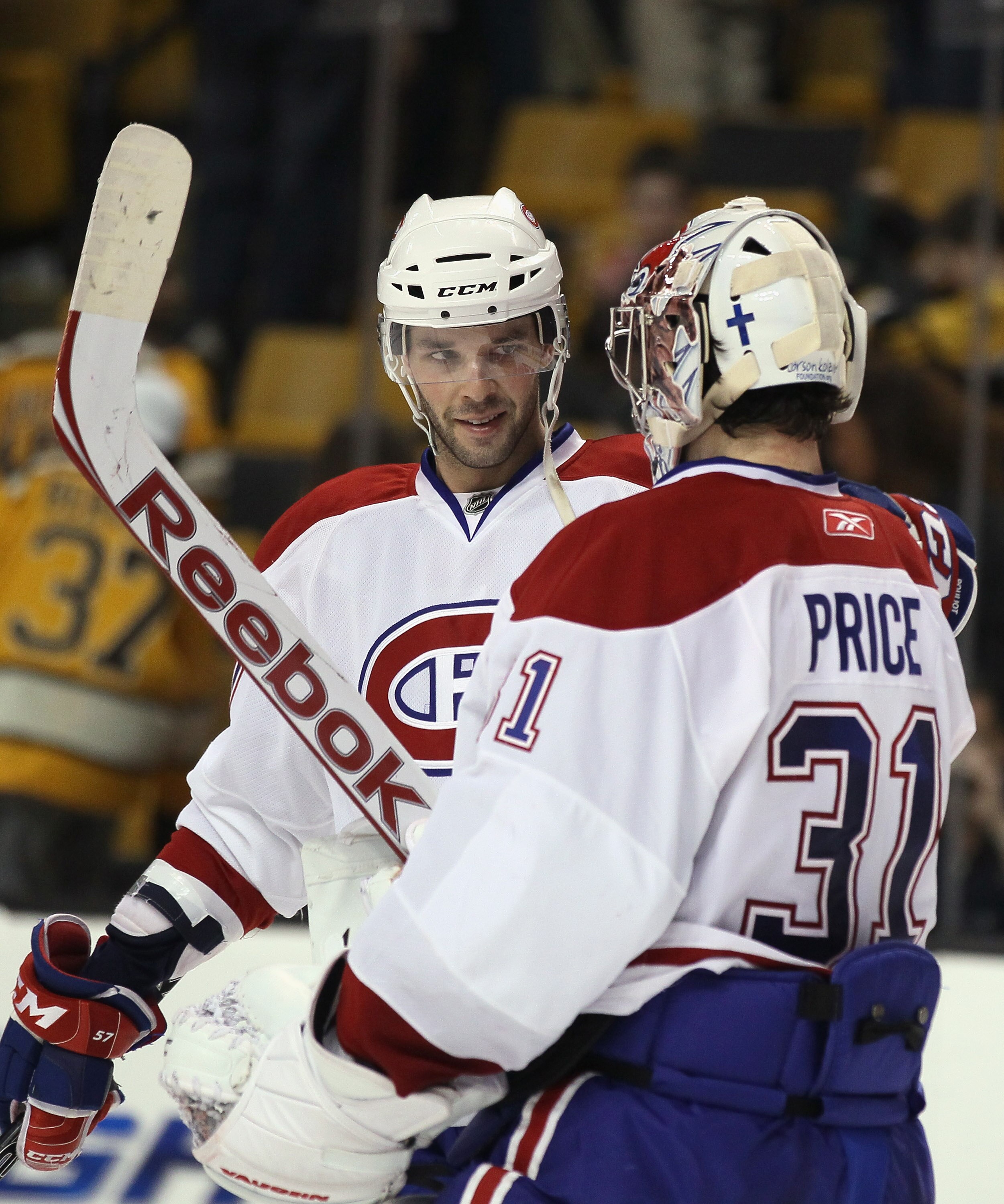 BOSTON, MA - APRIL 14:  Benoit Pouliot #57 of the Montreal Canadiens congratulates Carey Price #31 after Price shut out the Boston Bruins  in Game One of the Eastern Conference Quarterfinals during the 2011 NHL Stanley Cup Playoffs at TD Garden on April 1