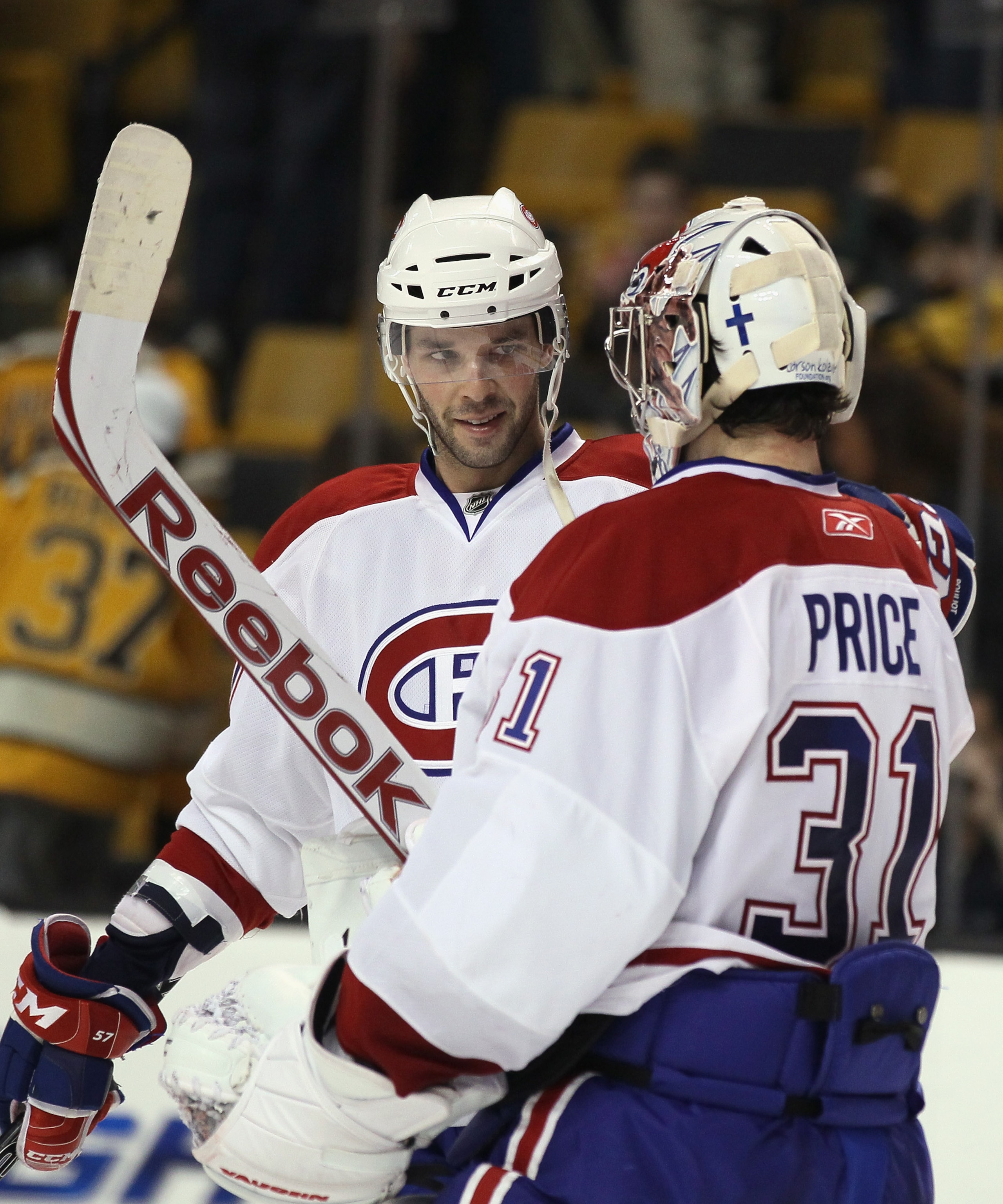 BOSTON, MA - APRIL 14:  Benoit Pouliot #57 of the Montreal Canadiens congratulates Carey Price #31 after Price shut out the Boston Bruins  in Game One of the Eastern Conference Quarterfinals during the 2011 NHL Stanley Cup Playoffs at TD Garden on April 1