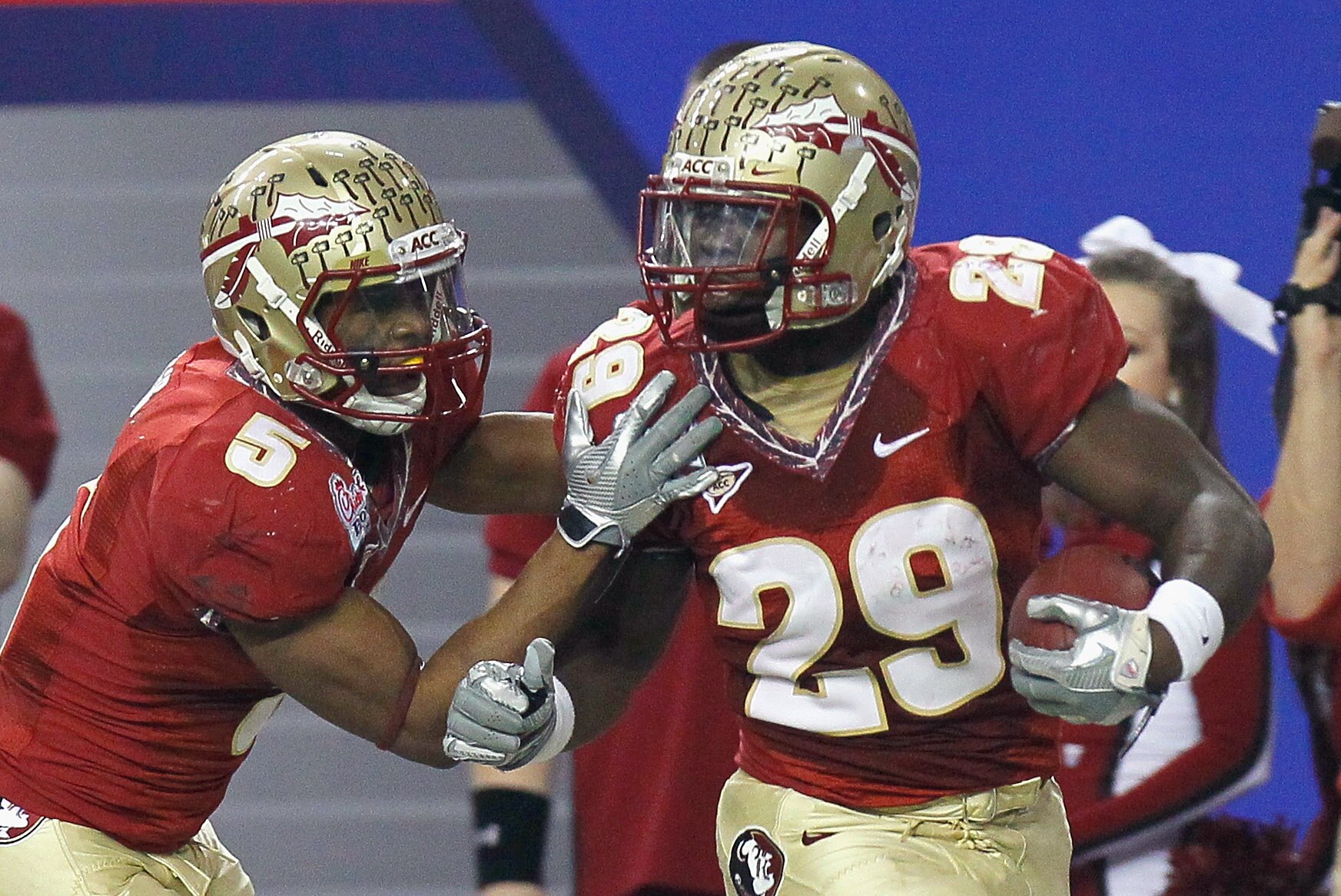 ATLANTA, GA - DECEMBER 31:  Kendall Smith #29 of the Florida State Seminoles reacts with Greg Reid #5 after an interception against the South Carolina Gamecocks during the 2010 Chick-fil-A Bowl at Georgia Dome on December 31, 2010 in Atlanta, Georgia.  (P