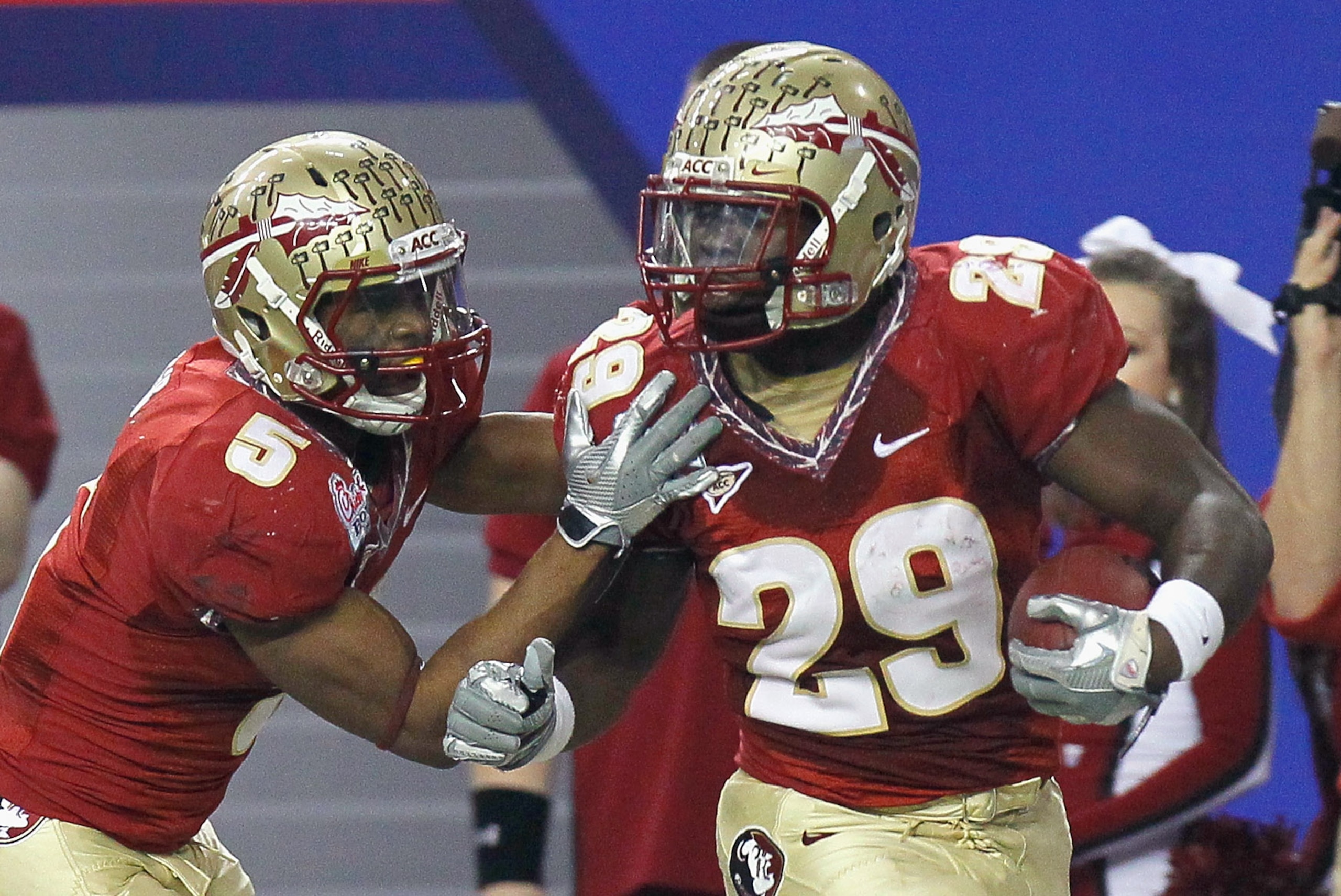 ATLANTA, GA - DECEMBER 31: Kendall Smith #29 of the Florida State Seminoles reacts with Greg Reid #5 after an interception against the South Carolina Gamecocks during the 2010 Chick-fil-A Bowl at Georgia Dome on December 31, 2010 in Atlanta, Georgia. (P ATLANTA, GA - DECEMBER 31: Kendall Smith #29 of the Florida State Seminoles reacts with Greg Reid #5 after an interception against the South Carolina Gamecocks during the 2010 Chick-fil-A Bowl at Georgia Dome on December 31, 2010 in Atlanta, Georgia. (P
