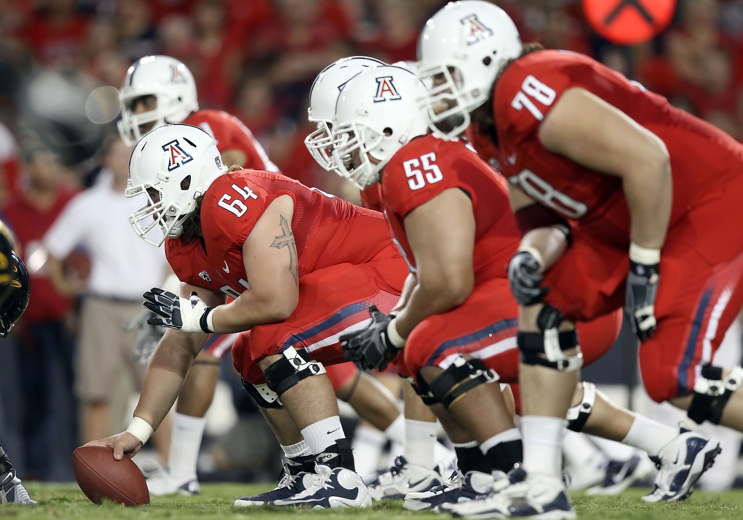 TUCSON, AZ - SEPTEMBER 25:  Center Colin Baxter #64 of the Arizona Wildcats prepares to snap the ball during the college football game against the California Golden Bears at Arizona Stadium on September 25, 2010 in Tucson, Arizona.   The Wildcats defeated