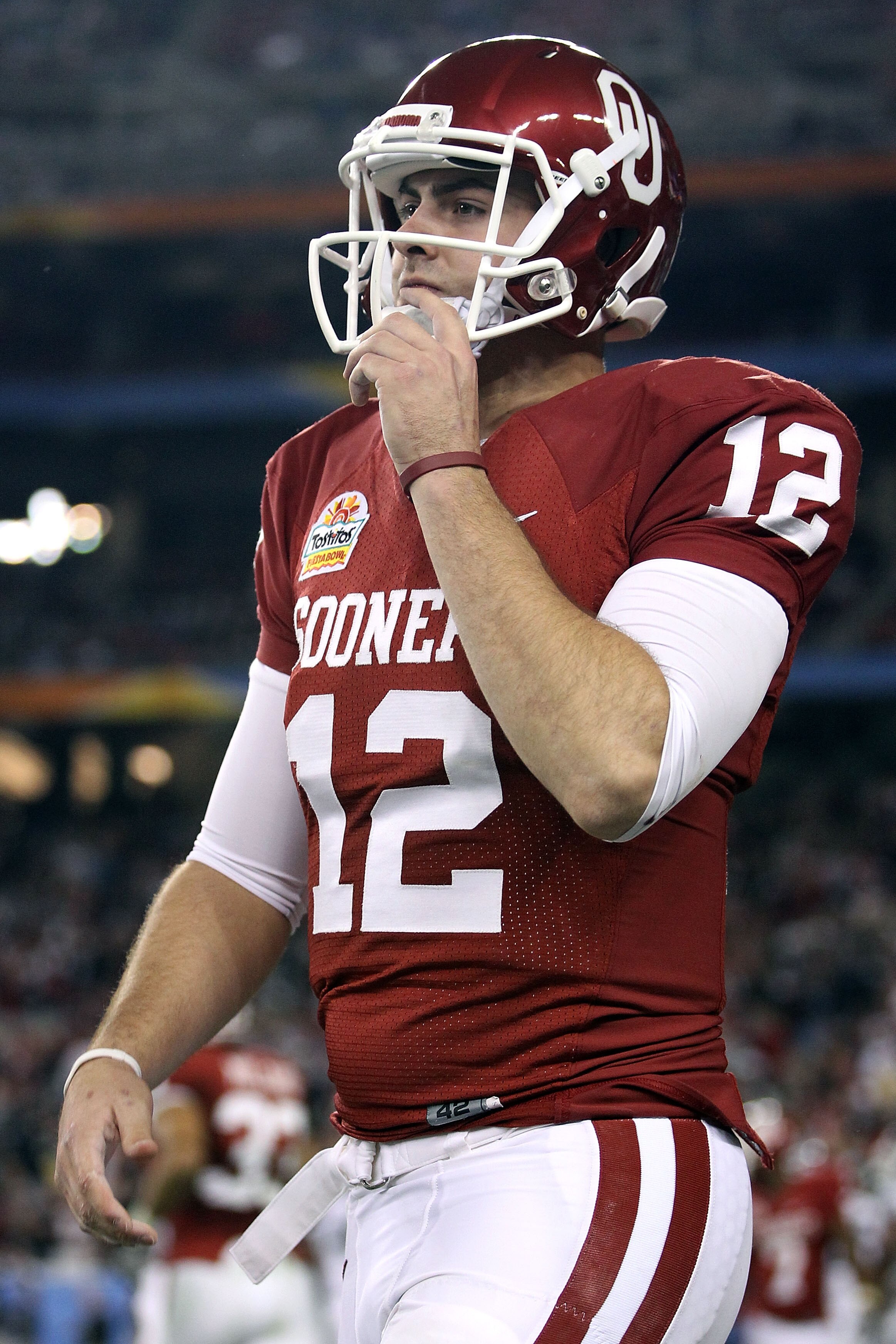 GLENDALE, AZ - JANUARY 01:  Landry Jones #12 of the Oklahoma Sooners looks on against the Connecticut Huskies during the Tostitos Fiesta Bowl at the Universtity of Phoenix Stadium on January 1, 2011 in Glendale, Arizona.  (Photo by Christian Petersen/Gett