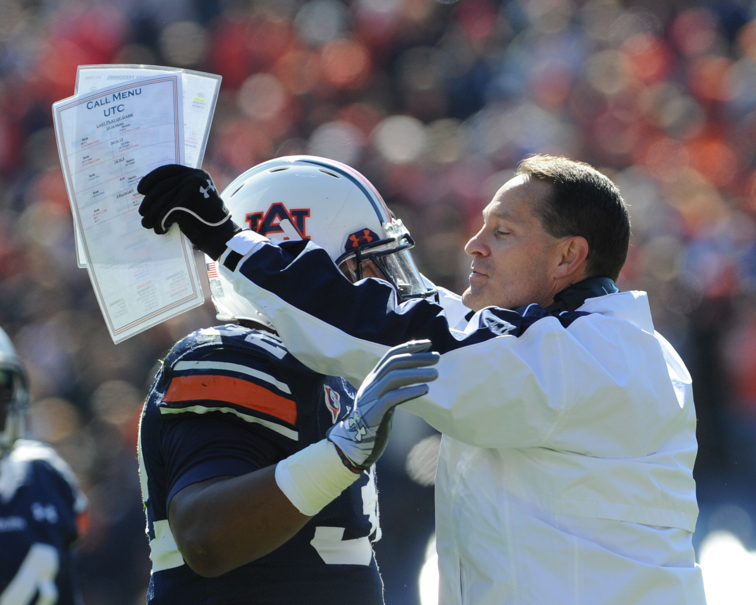 AUBURN, AL - NOVEMBER 06:  Coach Gene Chizik of the Auburn Tigers hugs running back Eric Smith #32 against the Chattanooga Mocs November 6, 2010 at Jordan-Hare Stadium in Auburn, Alabama.  (Photo by Al Messerschmidt/Getty Images)