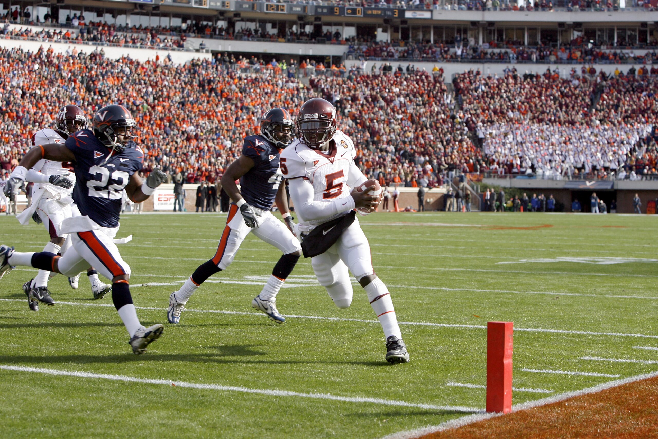 CHARLOTTESVILLE, VA - NOVEMBER 24: Quarterback Tyrod Taylor #5 of the Virginia Tech Hokies scores a touchdown against the Virginia Cavaliers at Scott Stadium on November 24, 2007 in Charlottesville, Virginia. Virginia Tech defeated Virginia 33-21. (Photo