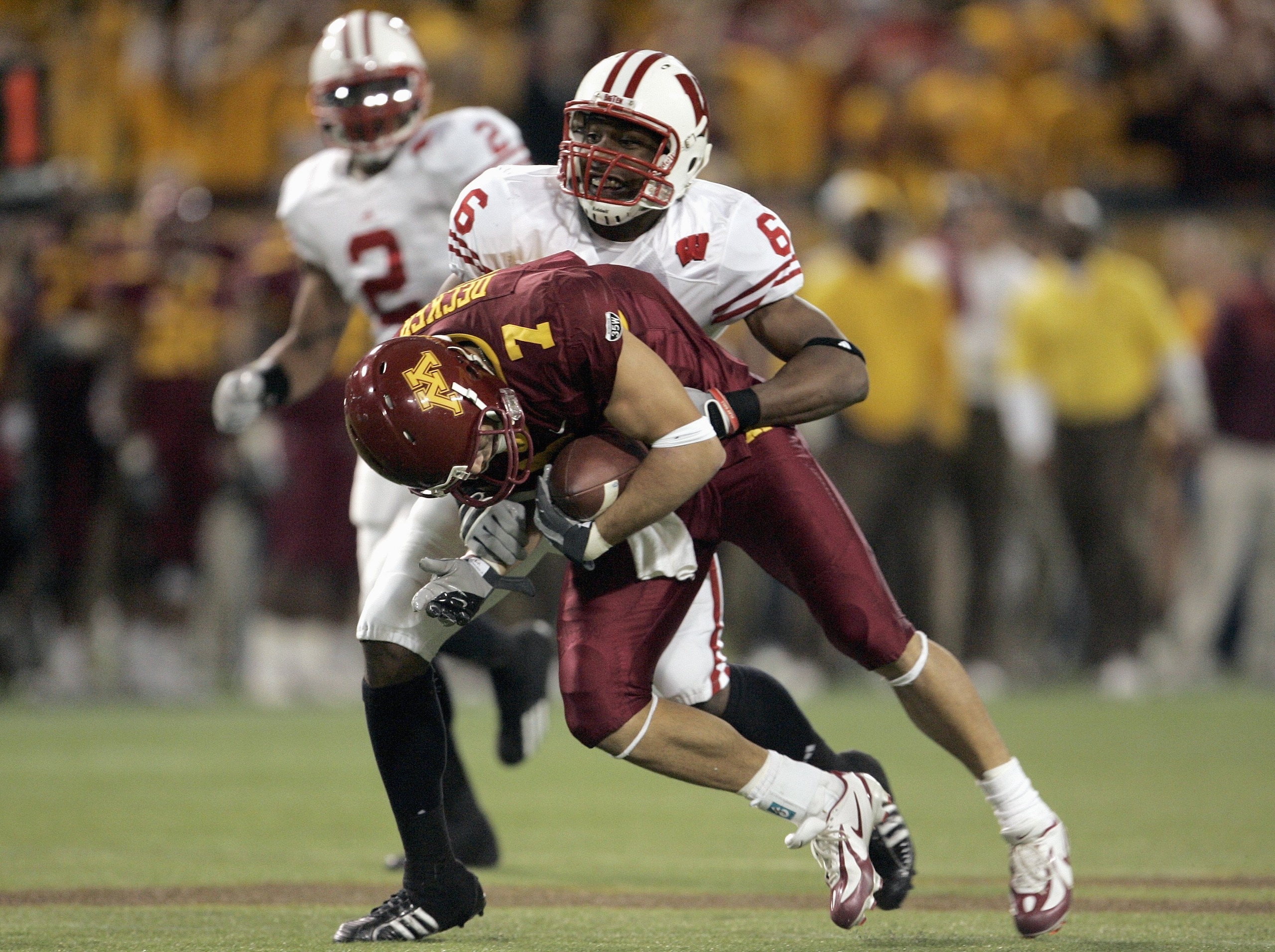 MINNEAPOLIS - NOVEMBER 17: Jack Ikegwuonu #6 of the Wisconsin Badgers grabs Eric Decker #7 of the Minnesota Golden Gophers at the Hubert H. Humphrey Metrodome November 17, 2007 in Minneapolis, Minnesota. (Photo by Jeff Gross/Getty Images)