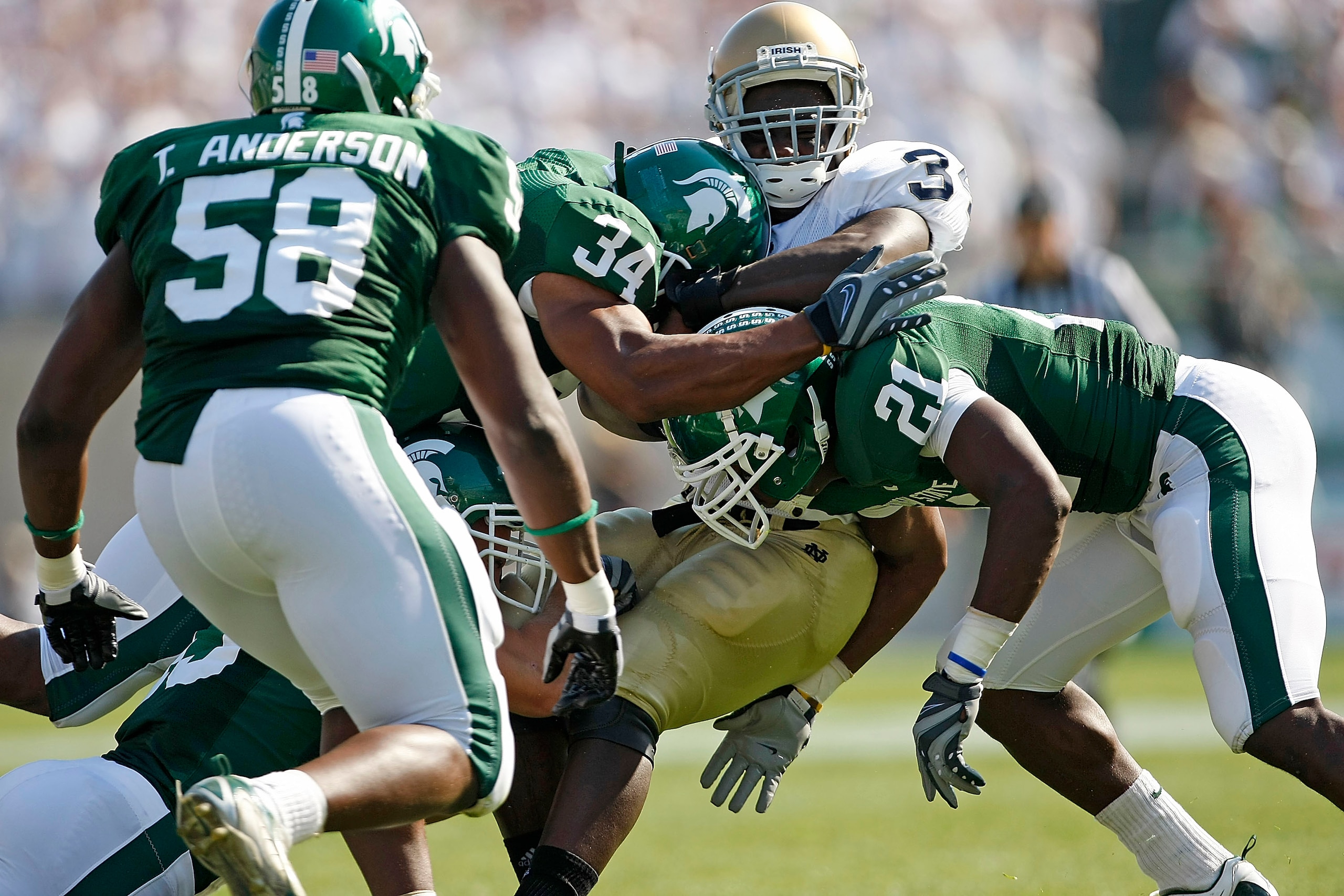 EAST LANSING, MI - SEPTEMBER 20:  James Aldridge #34 of the Notre Dame Fighting Irish attempts to run the ball against the Michigan State defense on September 20, 2008 at Spartan Stadium in East Lansing, Michigan. MSU won the game 23-7.  (Photo by Leon Ha