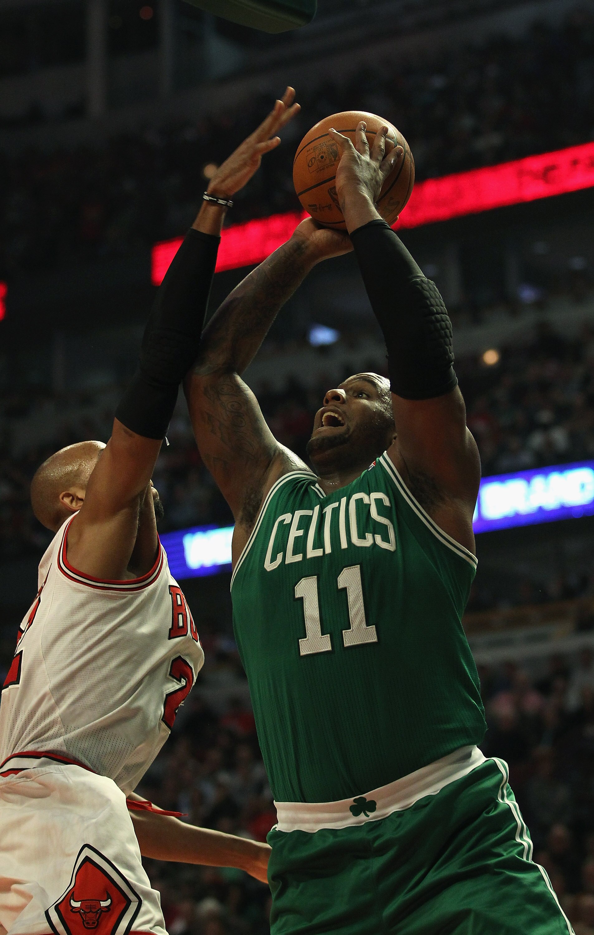CHICAGO, IL - APRIL 07: Taj Gibson #22 of the Chicago Bulls moves to block a shot by Glen Davis #11 of the Boston Celtics at United Center on April 7, 2011 in Chicago, Illinois. The Bulls defeated the Celtics 97-81. NOTE TO USER: User expressly acknowledg