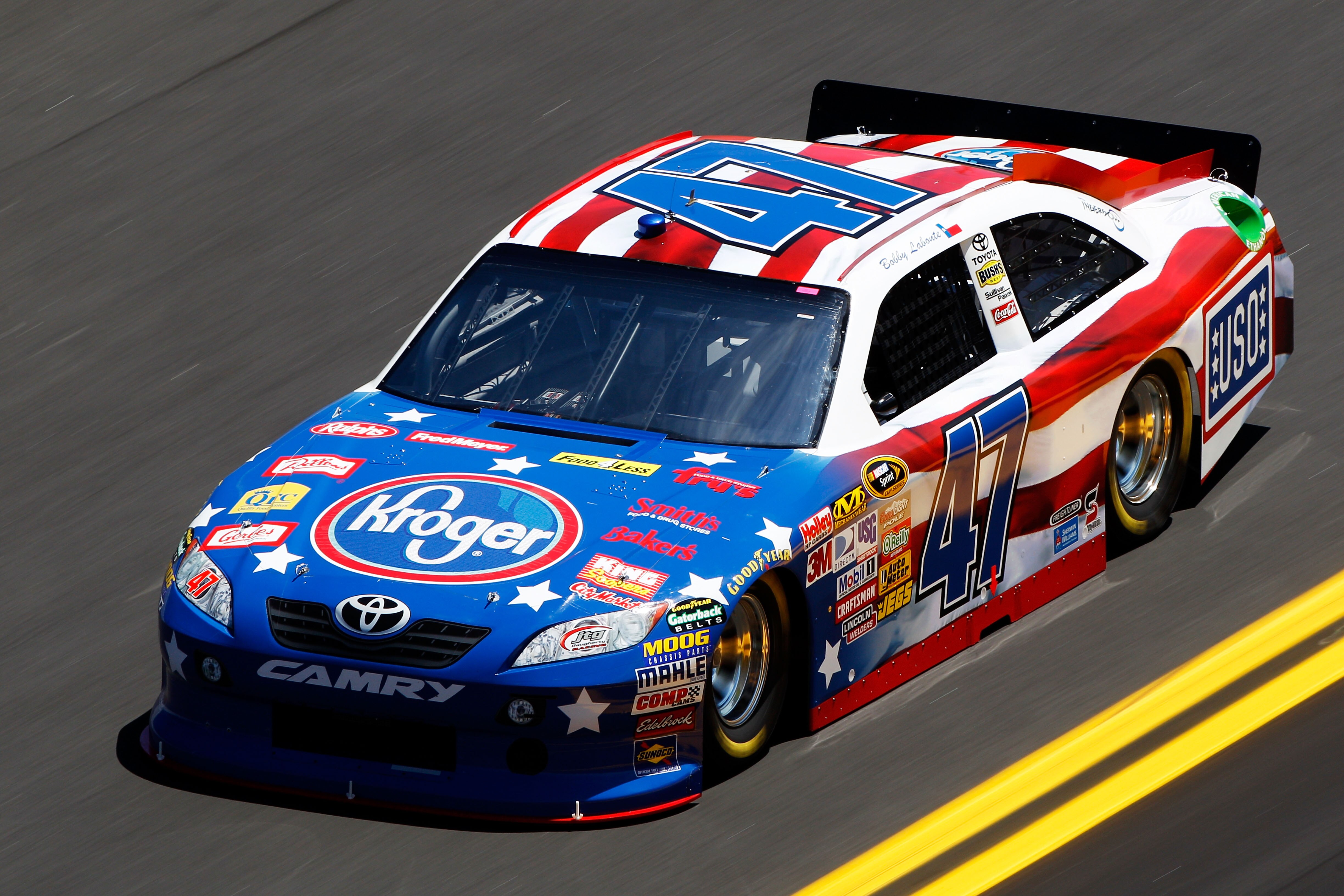 DAYTONA BEACH, FL - FEBRUARY 12:  Bobby Labonte, driver of the #47 Kroger/USO Toyota, practices for the NASCAR Sprint Cup Series Daytona 500 at Daytona International Speedway on February 12, 2011 in Daytona Beach, Florida.  (Photo by Chris Graythen/Getty