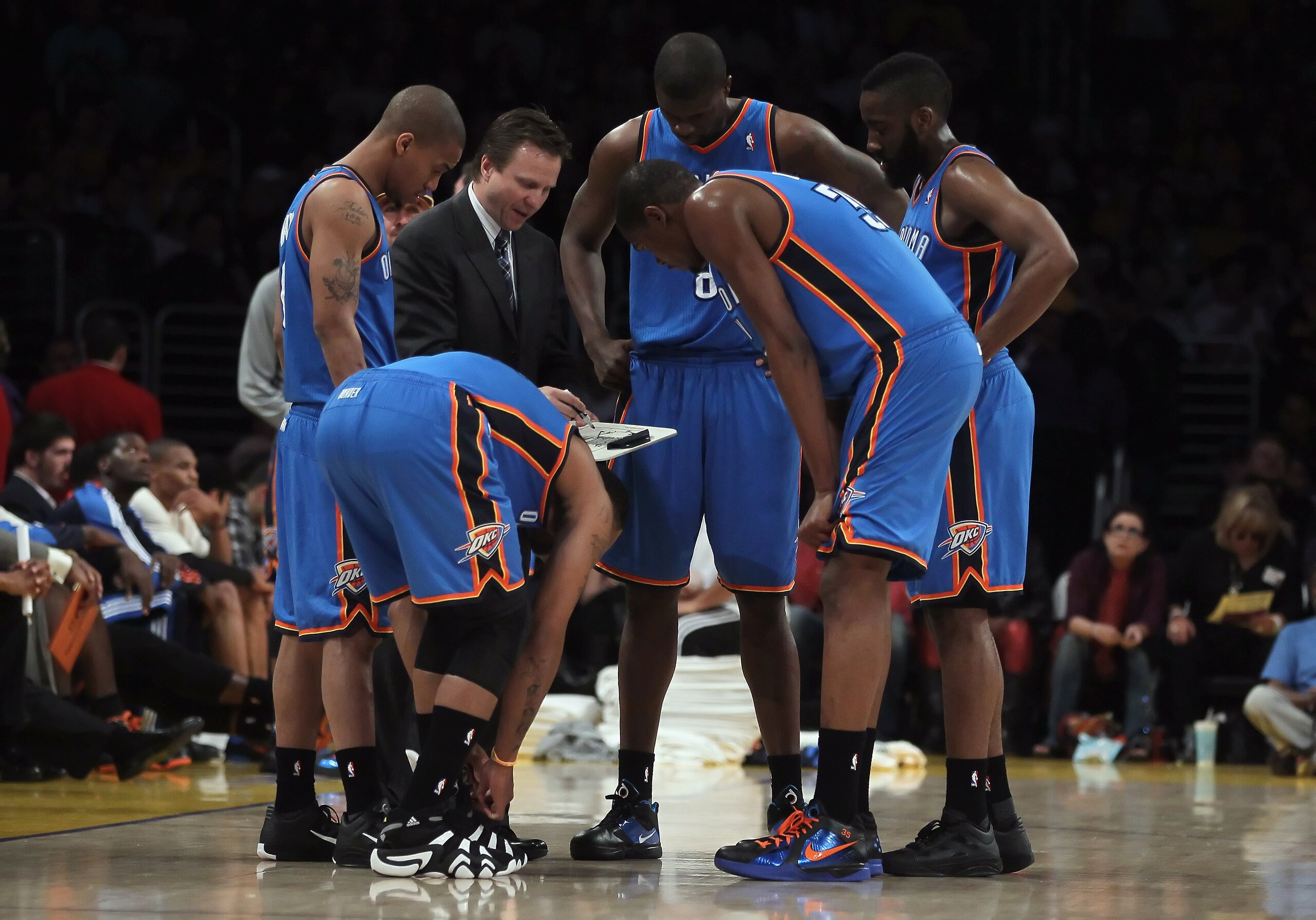 LOS ANGELES, CA - APRIL 10: Oklahoma City Thunder head coach Scott Brooks draws up a play for his team during a timeout in the first half against the Los Angeles Lakers at Staples Center on April 10, 2011 in Los Angeles, California. The Thunder defeated LOS ANGELES, CA - APRIL 10: Oklahoma City Thunder head coach Scott Brooks draws up a play for his team during a timeout in the first half against the Los Angeles Lakers at Staples Center on April 10, 2011 in Los Angeles, California. The Thunder defeated