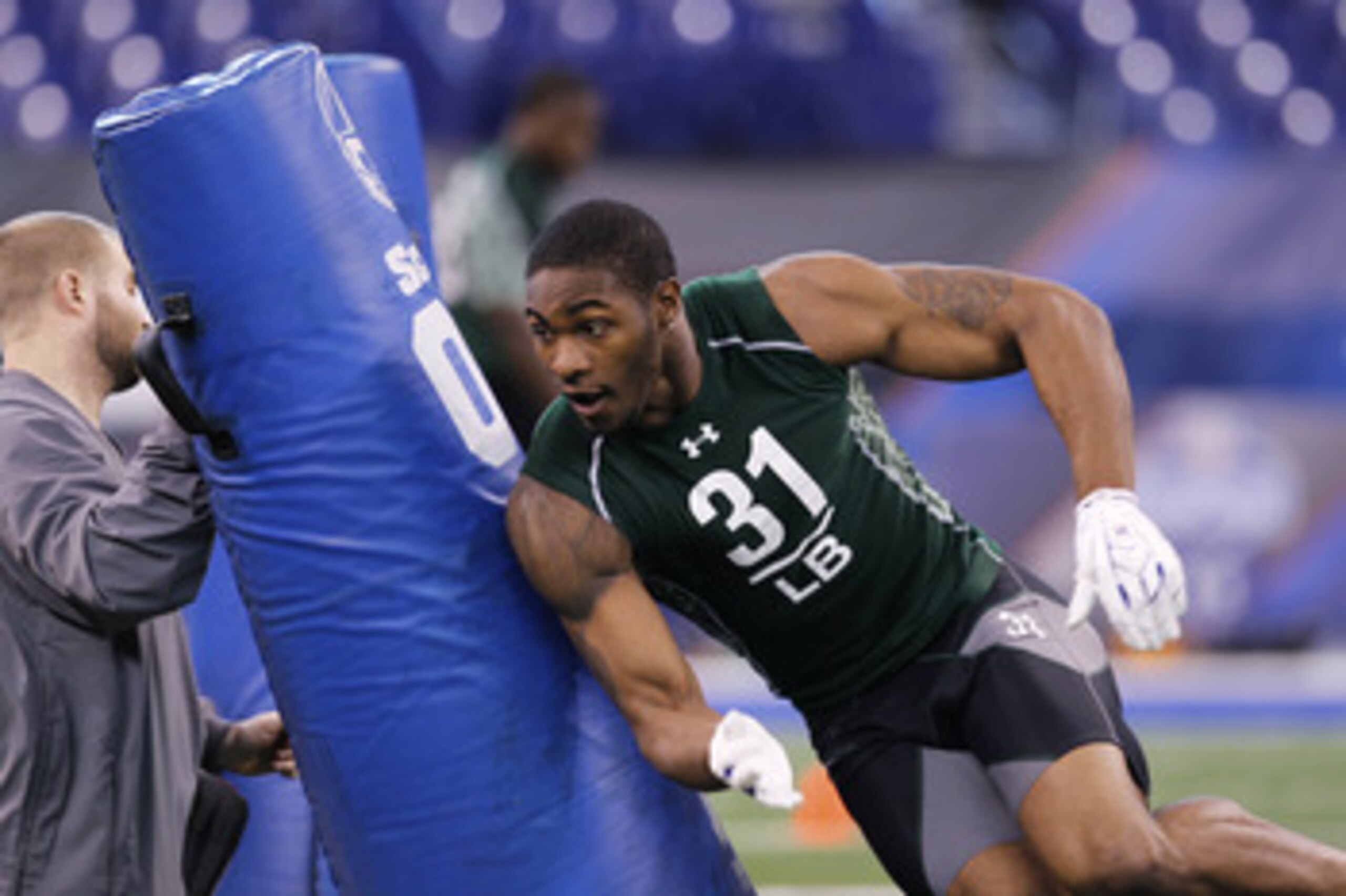 INDIANAPOLIS, IN - FEBRUARY 28: Martez Wilson of Illinois works out during the 2011 NFL Scouting Combine at Lucas Oil Stadium on February 28, 2011 in Indianapolis, Indiana. (Photo by Joe Robbins/Getty Images) INDIANAPOLIS, IN - FEBRUARY 28: Martez Wilson of Illinois works out during the 2011 NFL Scouting Combine at Lucas Oil Stadium on February 28, 2011 in Indianapolis, Indiana. (Photo by Joe Robbins/Getty Images)