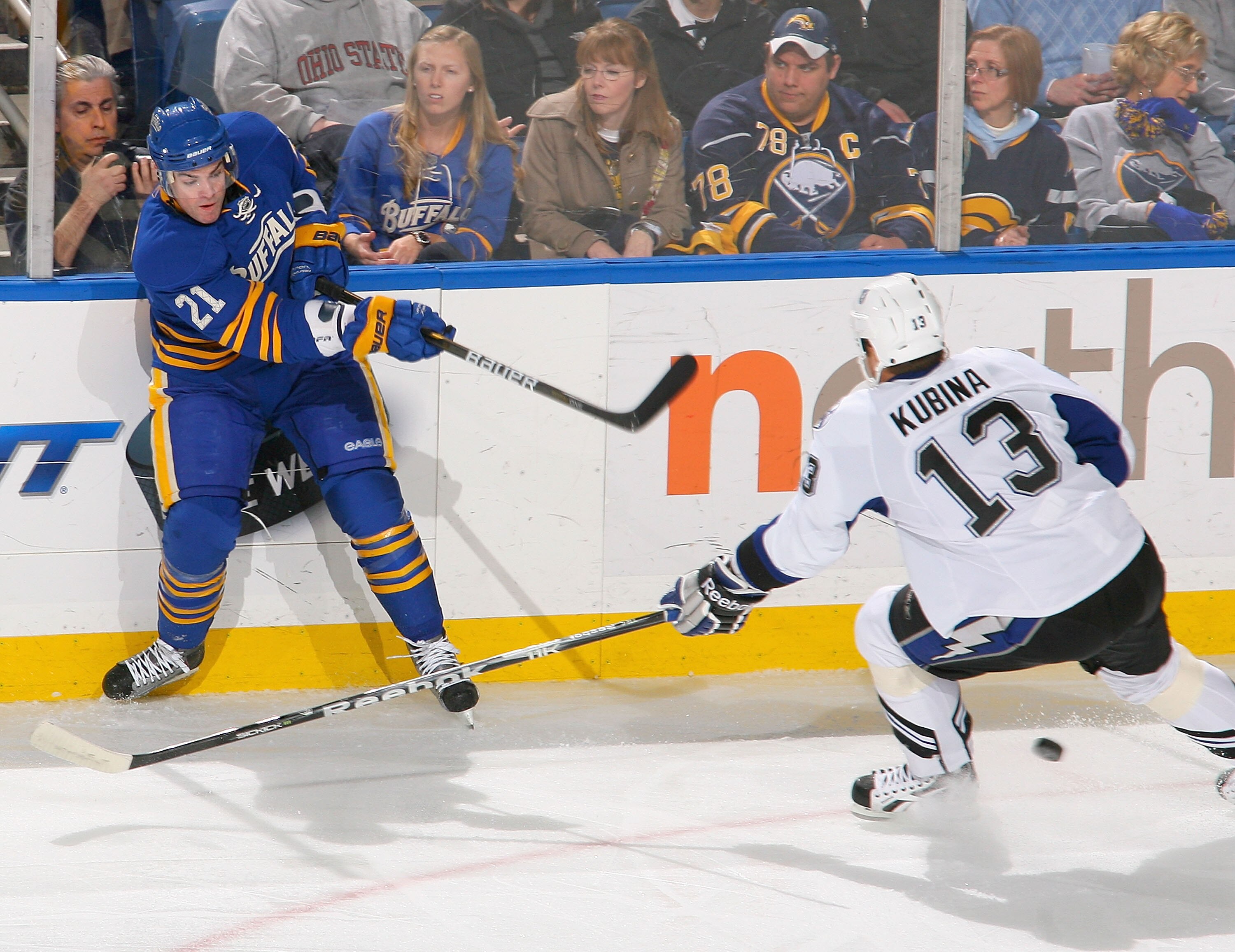 BUFFALO, NY - APRIL 05: Drew Stafford #21 of the Buffalo Sabres gets a shot off against Pavel Kubina #13 of the Tampa Bay Lightning at HSBC Arena on April 5, 2011 in Buffalo, New York.  (Photo by Rick Stewart/Getty Images)