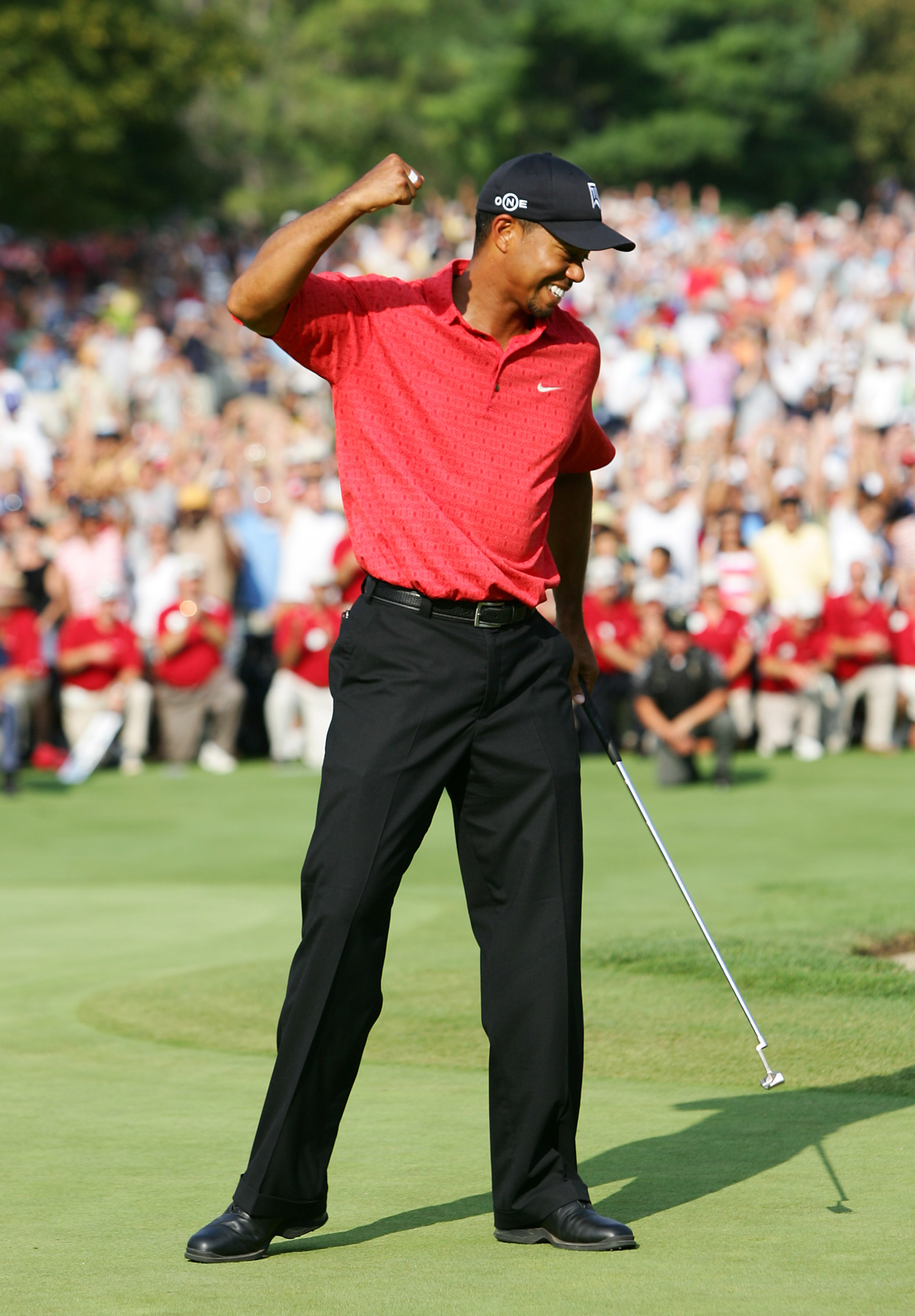 UNITED STATES - AUGUST 06:  Tiger Woods reacts to winning the Buick Open at Warwick Hills Golf and Country Club in Grand Blanc, Michigan on August 6, 2006.  (Photo by Sam Greenwood/Getty Images)