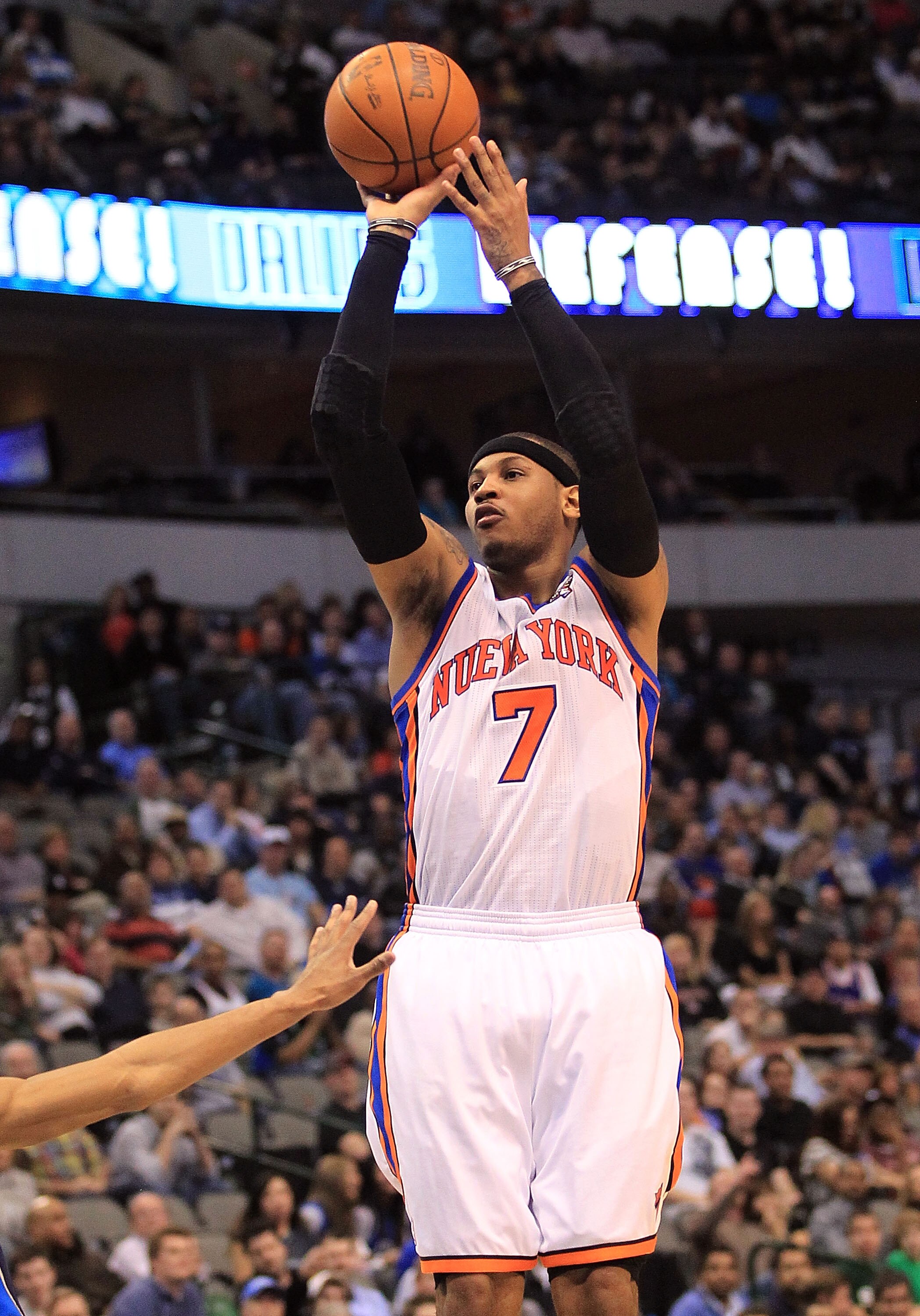 DALLAS, TX - MARCH 10:  Forward Carmelo Anthony #7 of the New York Knicks takes a shot against the Dallas Mavericks at American Airlines Center on March 10, 2011 in Dallas, Texas.  NOTE TO USER: User expressly acknowledges and agrees that, by downloading