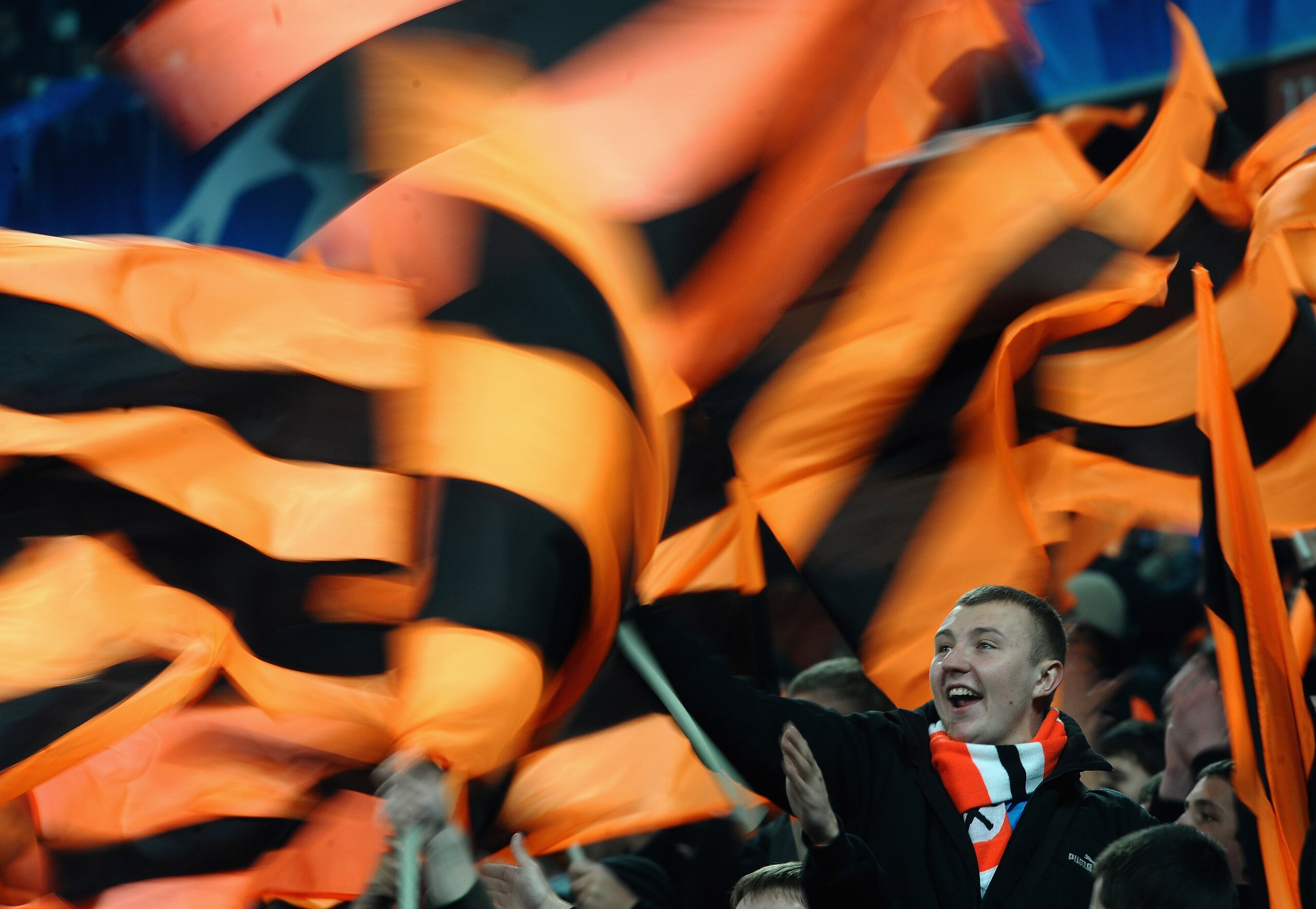 DONETSK, UKRAINE - APRIL 12: A Shakhtar Donetsk fan waves his flag during the UEFA Champions League Quarter Final 2nd Leg match between Shakhtar Donetsk and Barcelona at the Donbass Arena on April 12, 2011 in Donetsk, Ukraine.  (Photo by Laurence Griffith