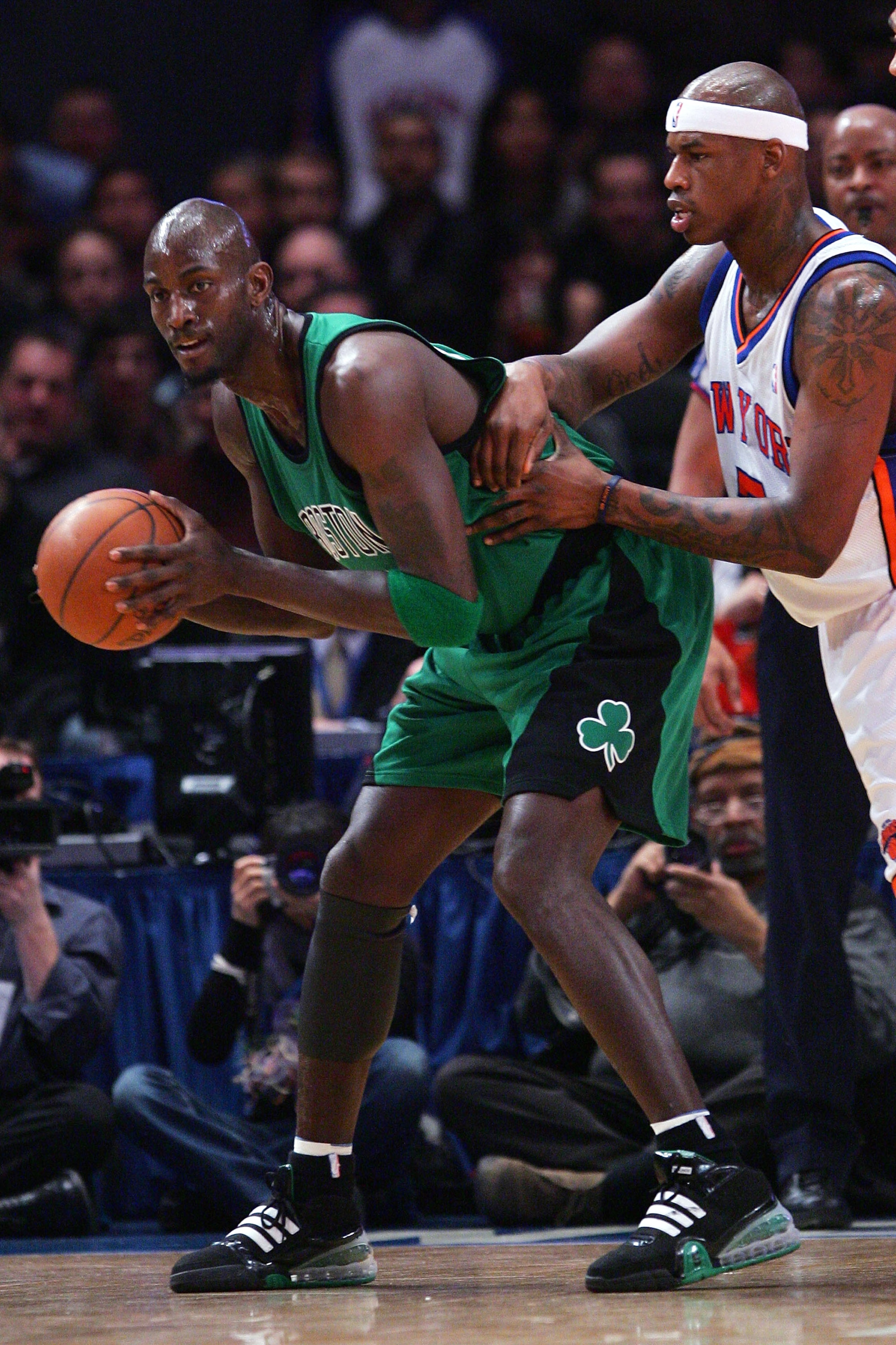 NEW YORK - FEBRUARY 06:  Kevin Garnett #5 of the Boston Celtics holds off Al Harrington #7 of the New York Knicks at Madison Square Garden February 6, 2009 in New York City. NOTE TO USER: User expressly acknowledges and agrees that, by downloading and/or