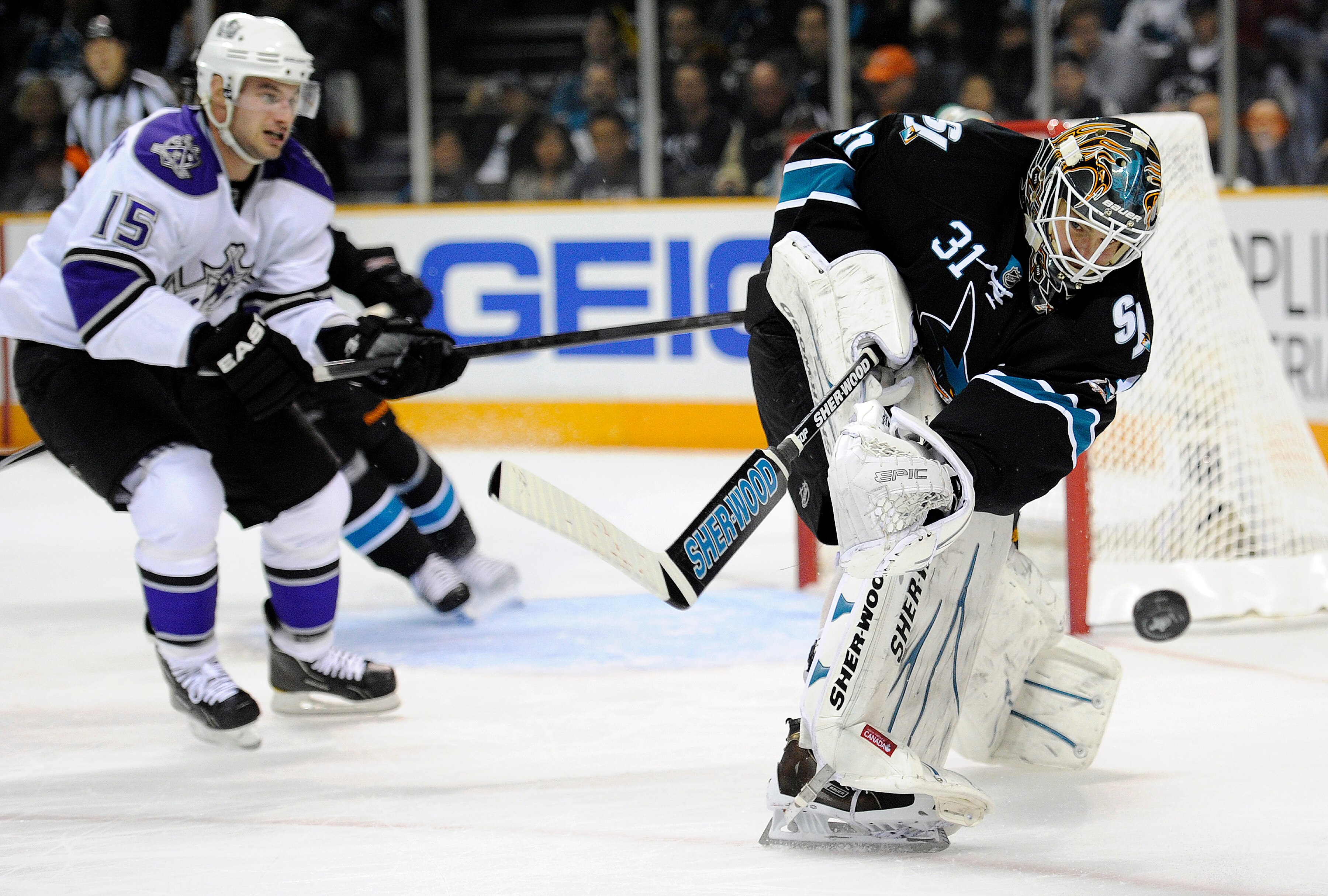 SAN JOSE, CA - APRIL 14: Antti Niemi #31 of the San Jose Sharks clears the puck away from his goal against the Los Angeles Kings in Game One of the Western Conference Quarterfinals during the 2011 NHL Stanley Cup Playoffs at the HP Pavilion on April 14, 2
