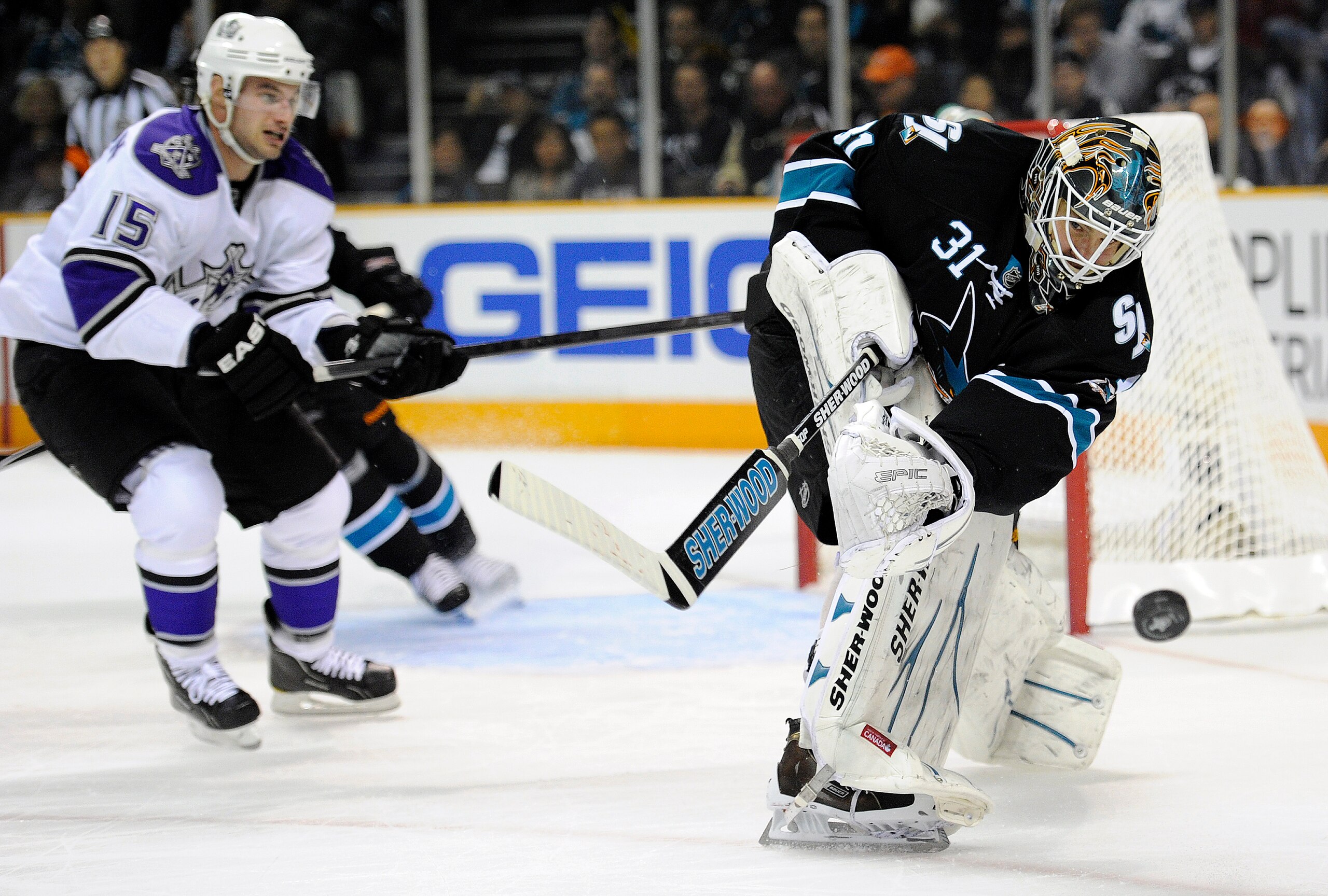 SAN JOSE, CA - APRIL 14: Antti Niemi #31 of the San Jose Sharks clears the puck away from his goal against the Los Angeles Kings in Game One of the Western Conference Quarterfinals during the 2011 NHL Stanley Cup Playoffs at the HP Pavilion on April 14, 2