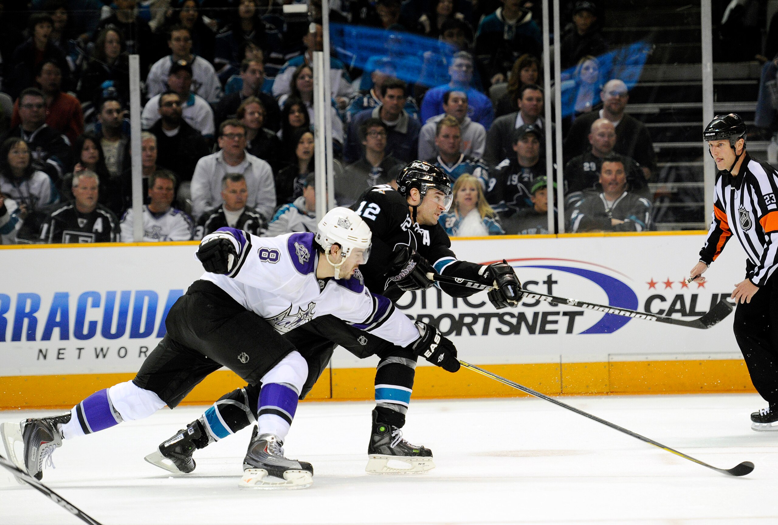 SAN JOSE, CA - APRIL 14: Patrick Marleau #12 of the San Jose Sharks, in overtime shoots on goal pass Drew Doughty #8 of the Los Angeles Kings in Game One of the Western Conference Quarterfinals  during the 2011 NHL Stanley Cup Playoffs at the HP Pavilion